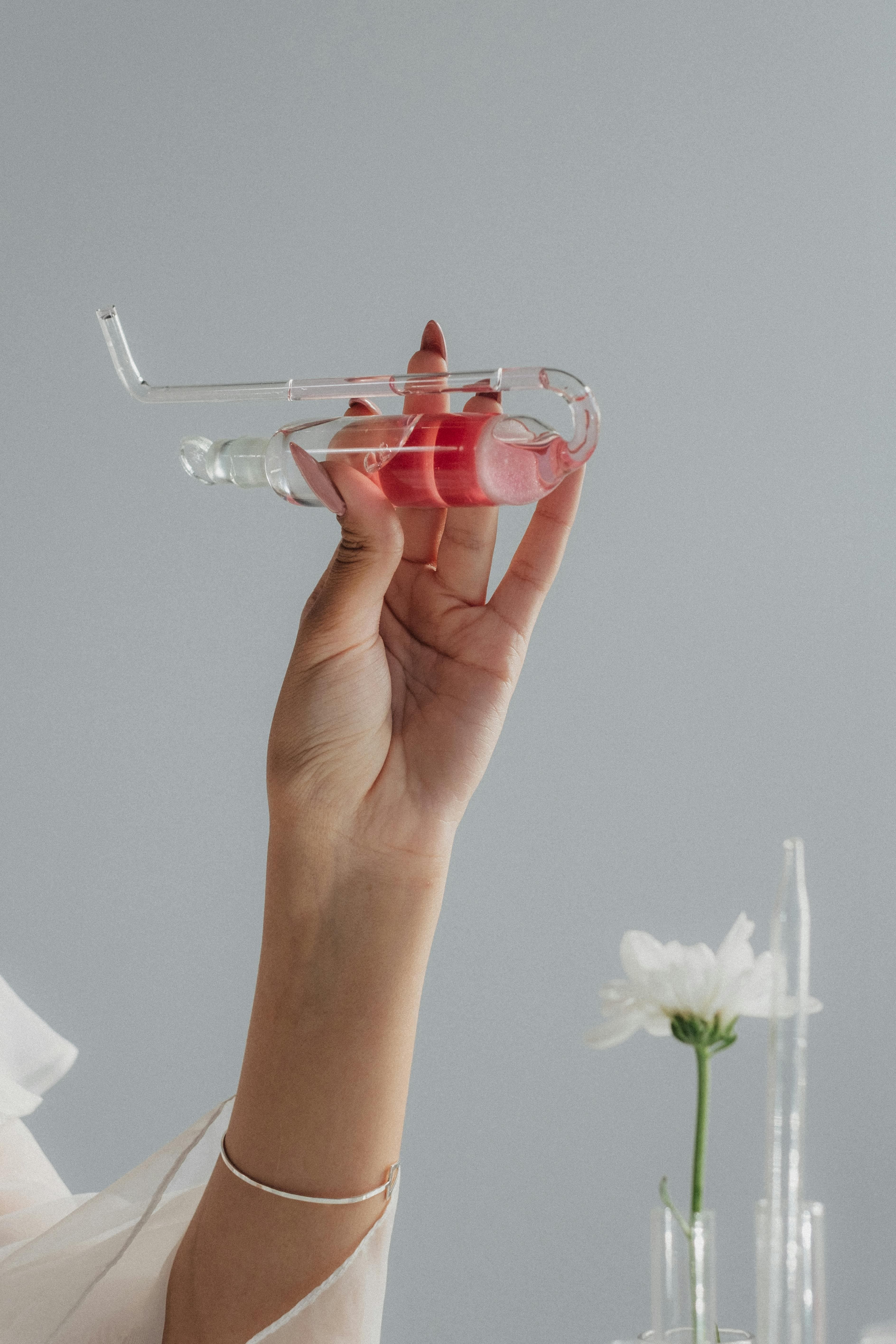 A clear glass container with reddish-brown iodine solution