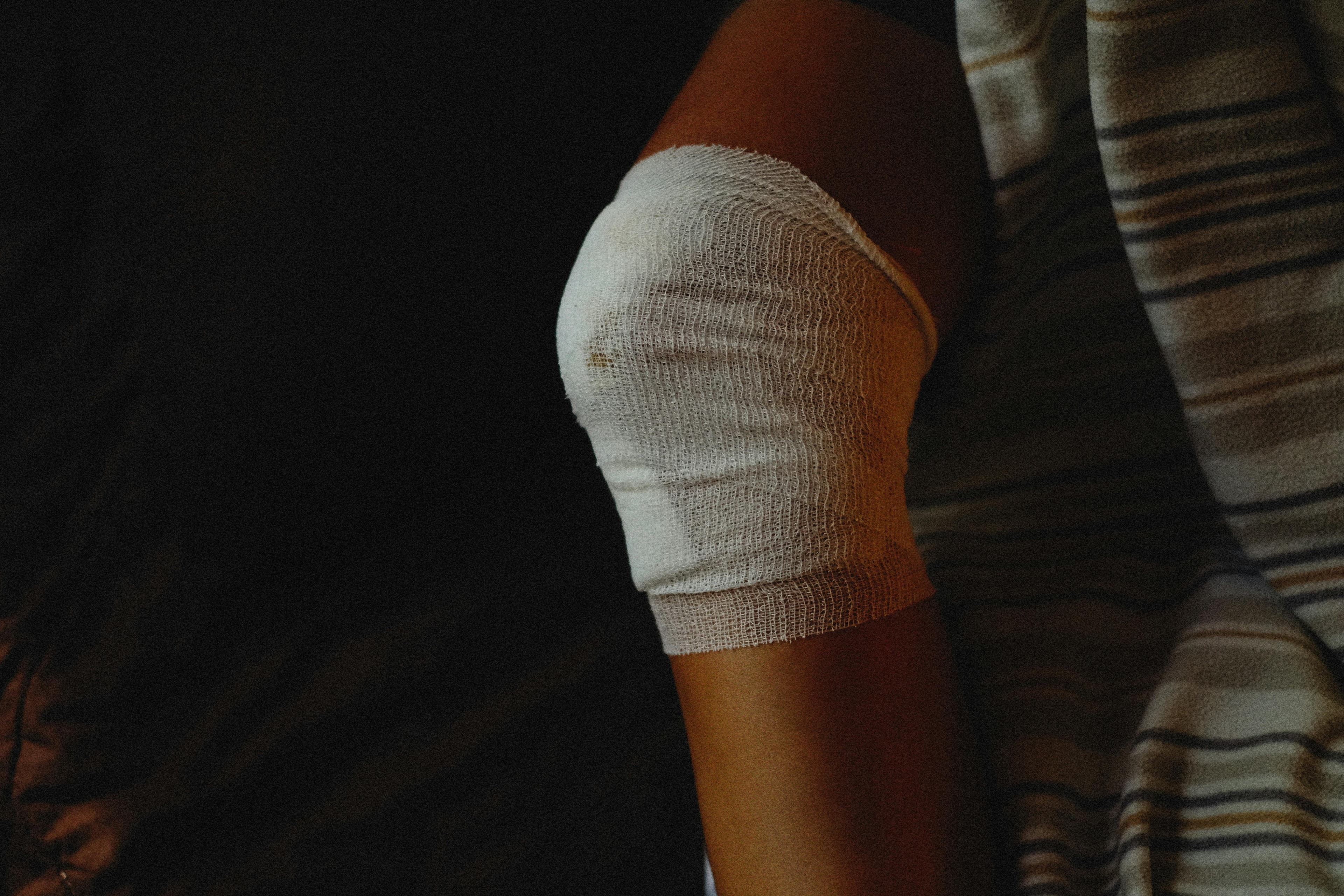 A doctor examining a skin wound and prescribing antibiotics