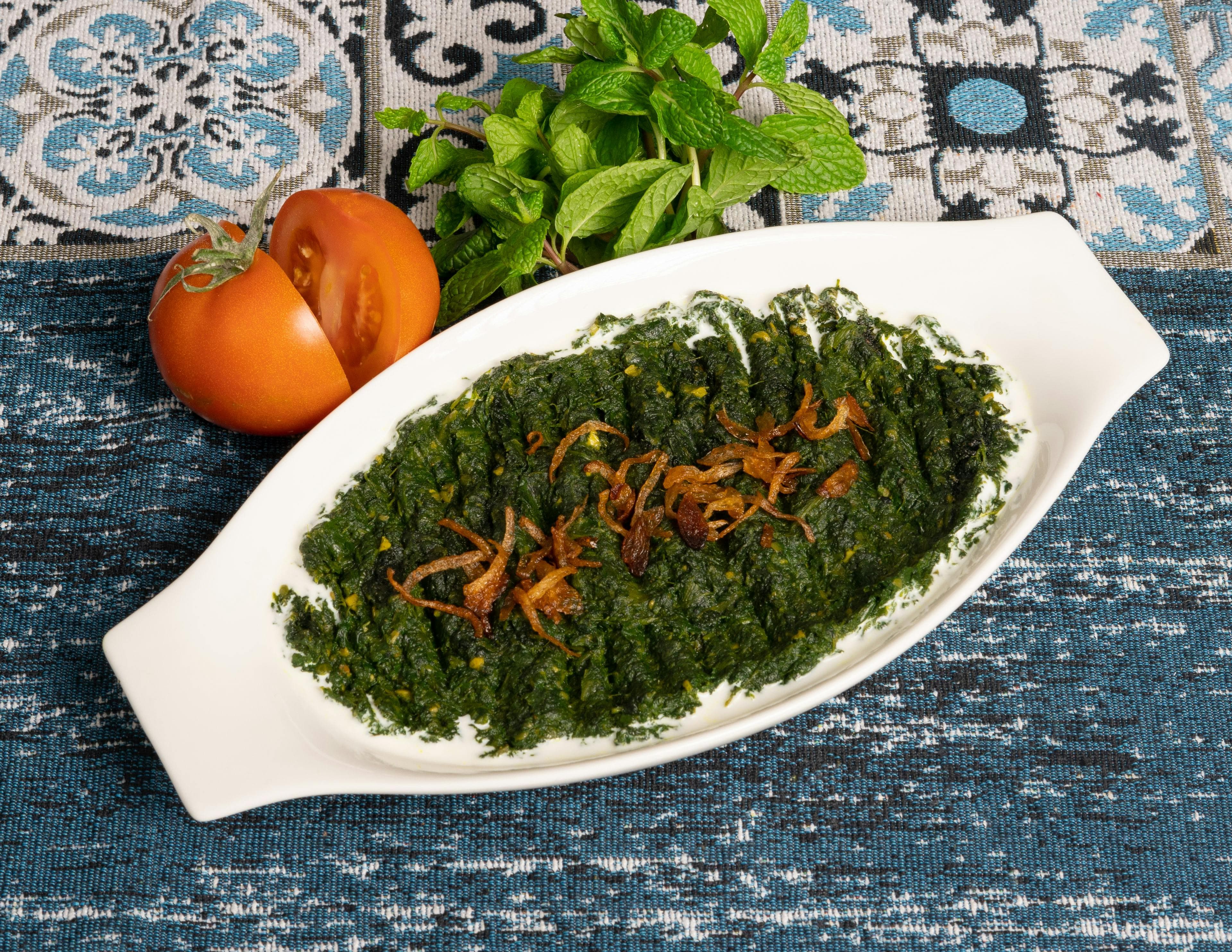 A colorful plate filled with anti-inflammatory foods like salmon, leafy greens, berries, and whole grains