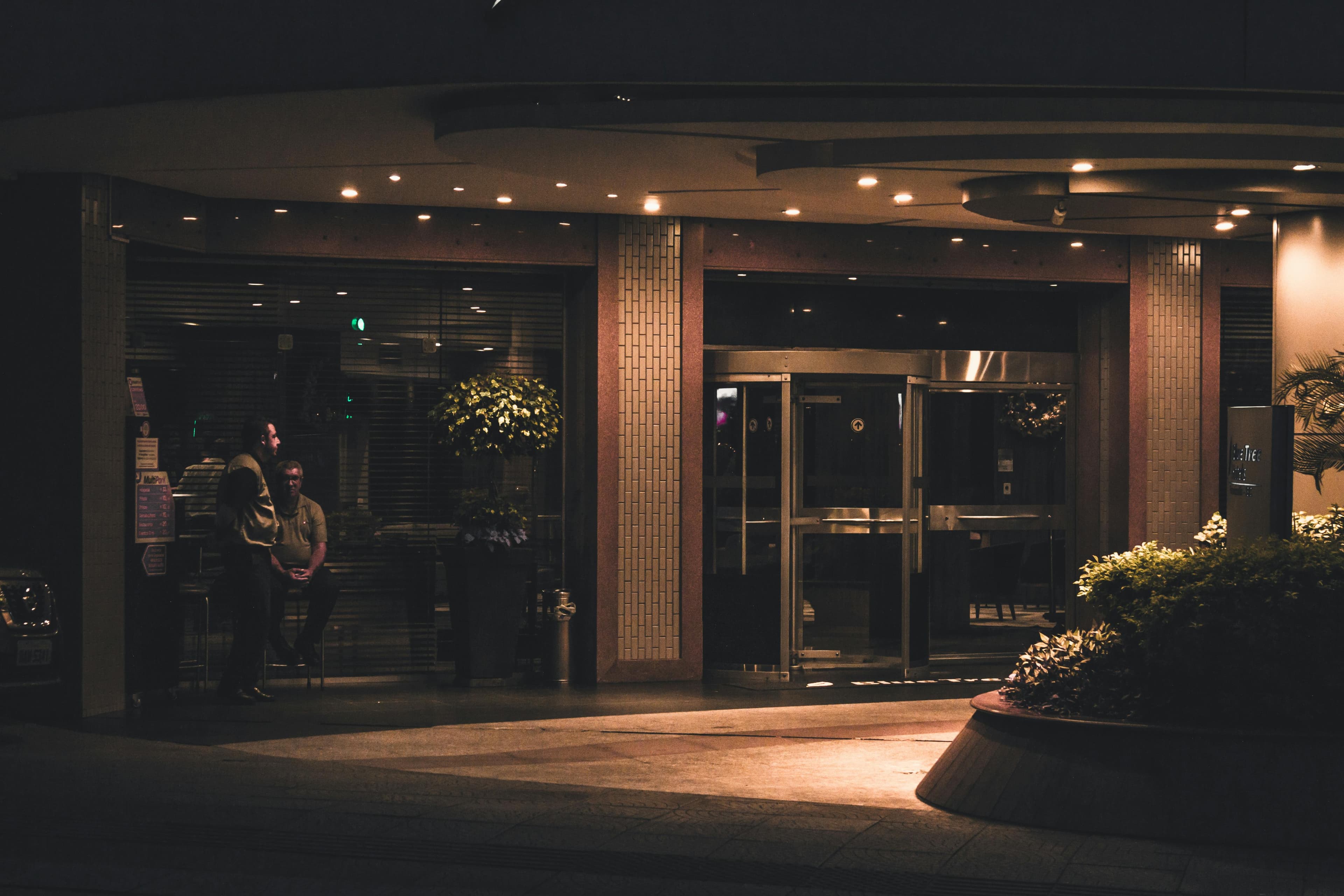 A modern private hospital building with a welcoming entrance and landscaped grounds