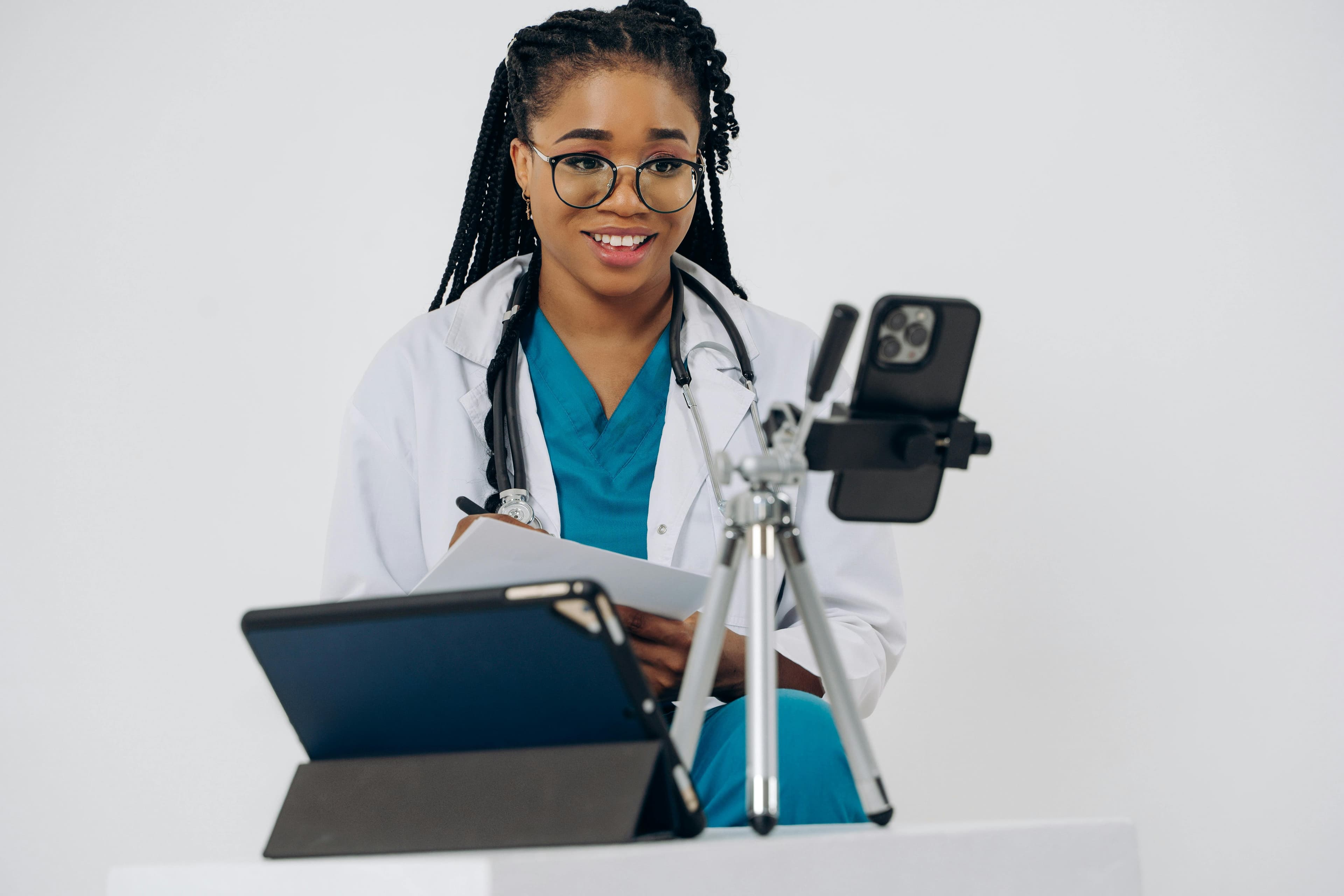 A patient having a video consultation with a healthcare provider on a tablet or smartphone