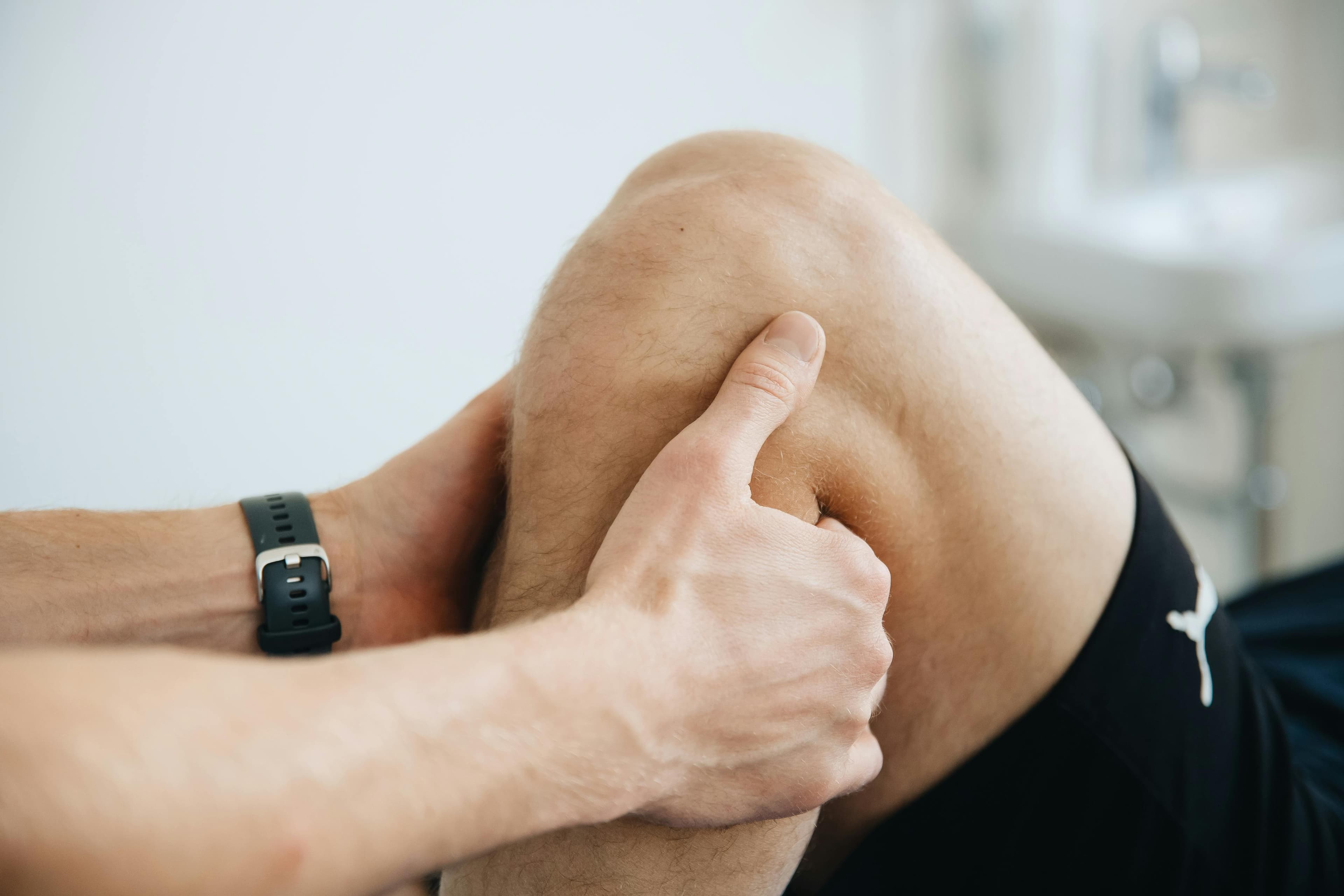 Patient performing knee rehabilitation exercises under supervision