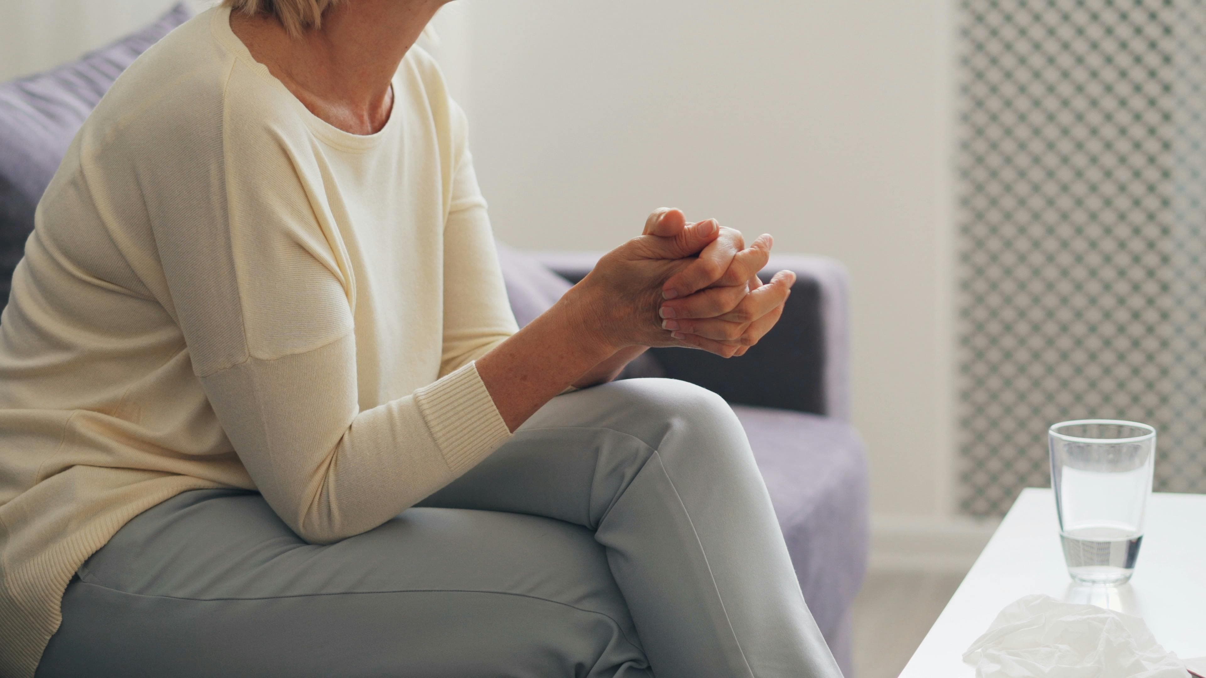 A female doctor consulting with a middle-aged female patient, possibly discussing perimenopausal symptoms