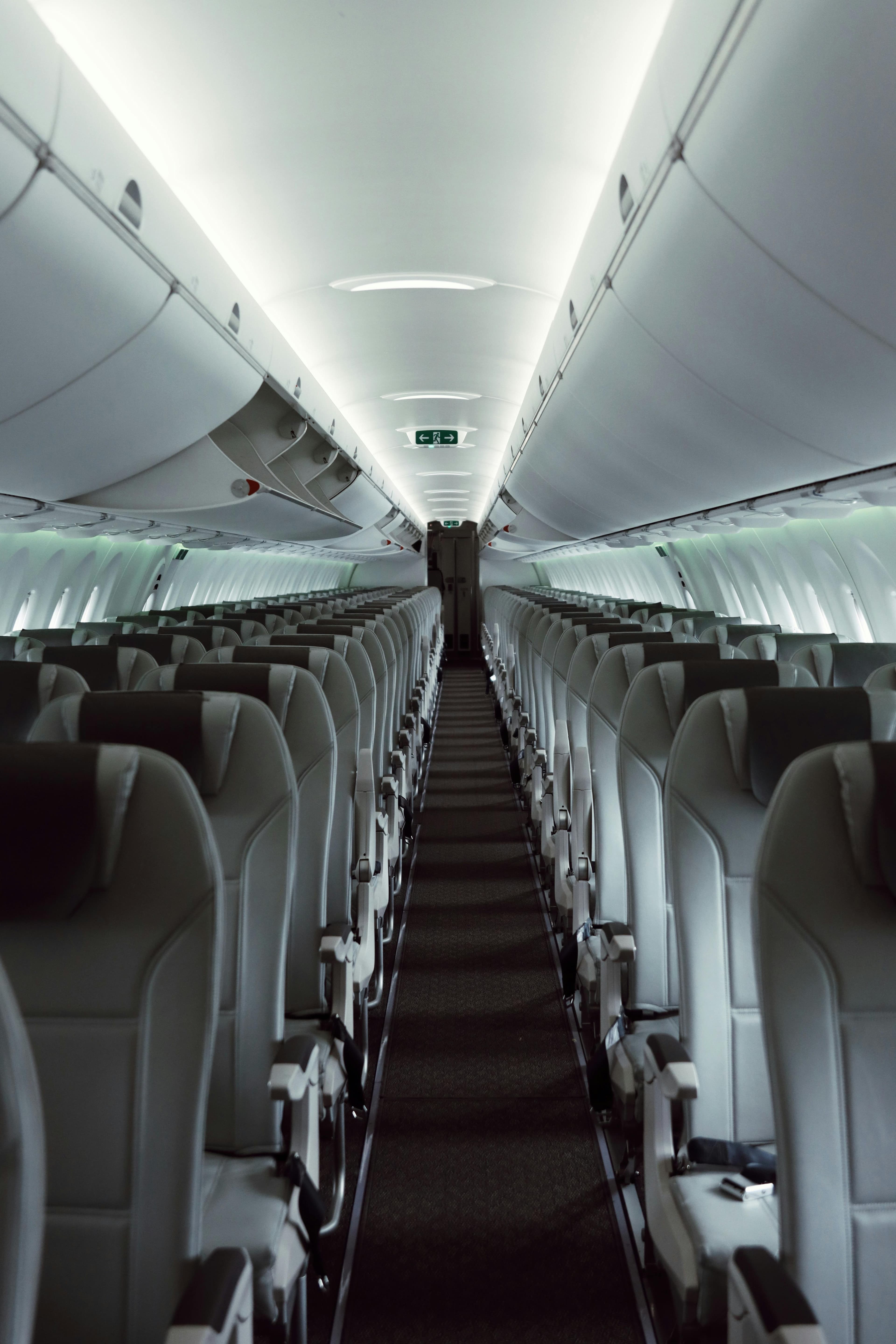 Interior of an airplane cabin with passengers seated