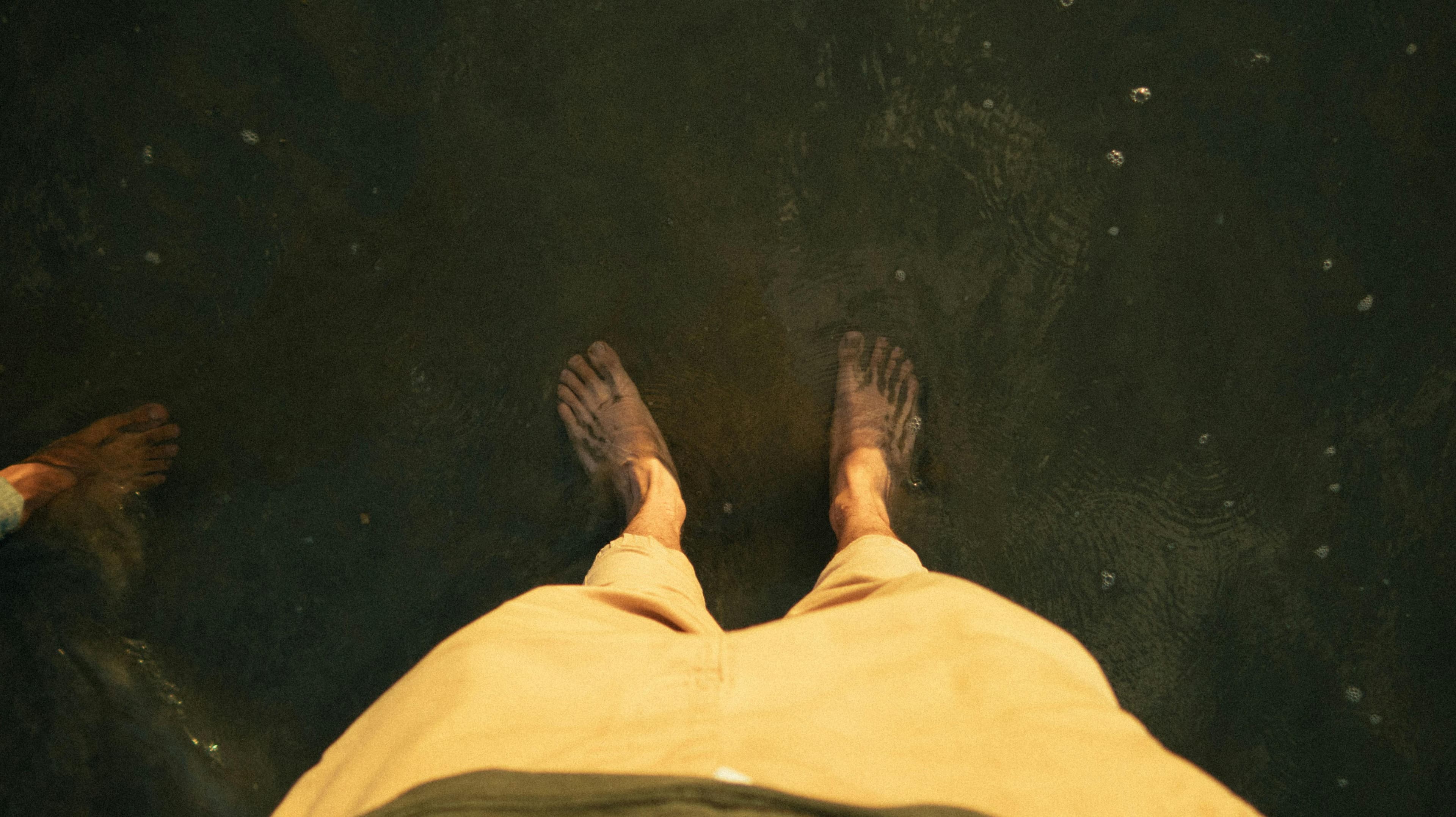 Person soaking their feet in a basin of water