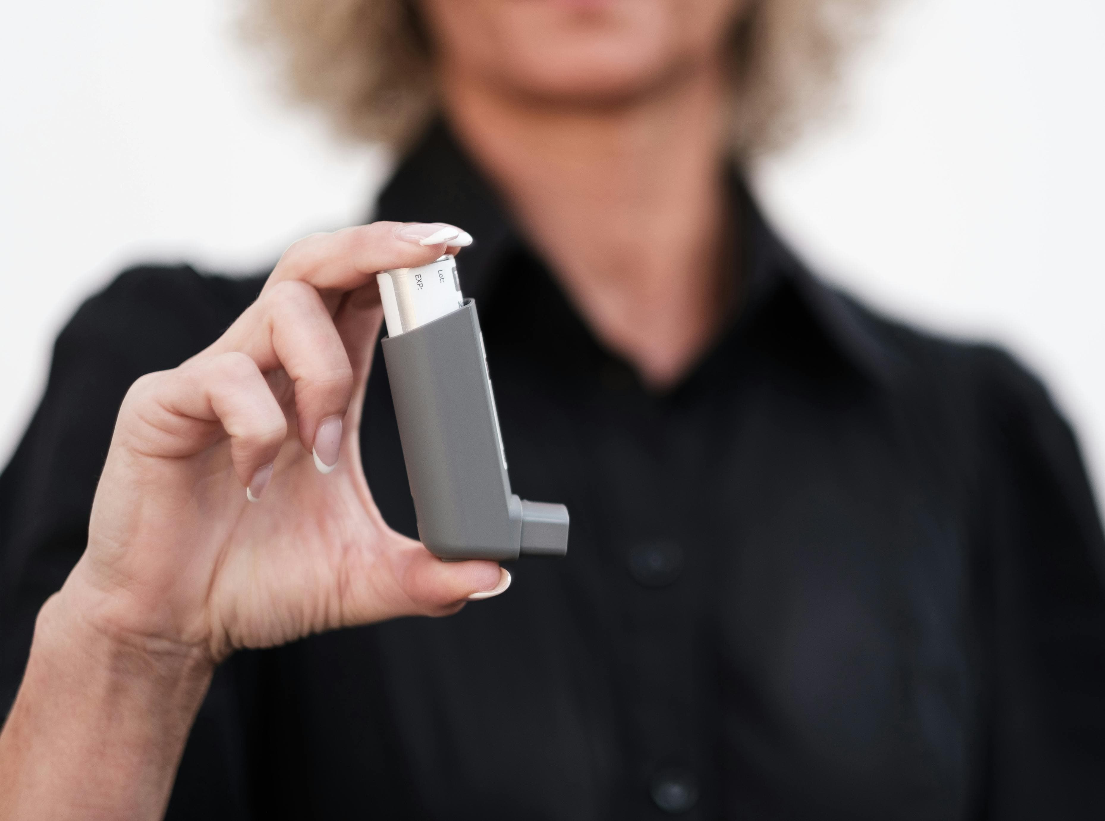 Person rinsing mouth with saltwater solution