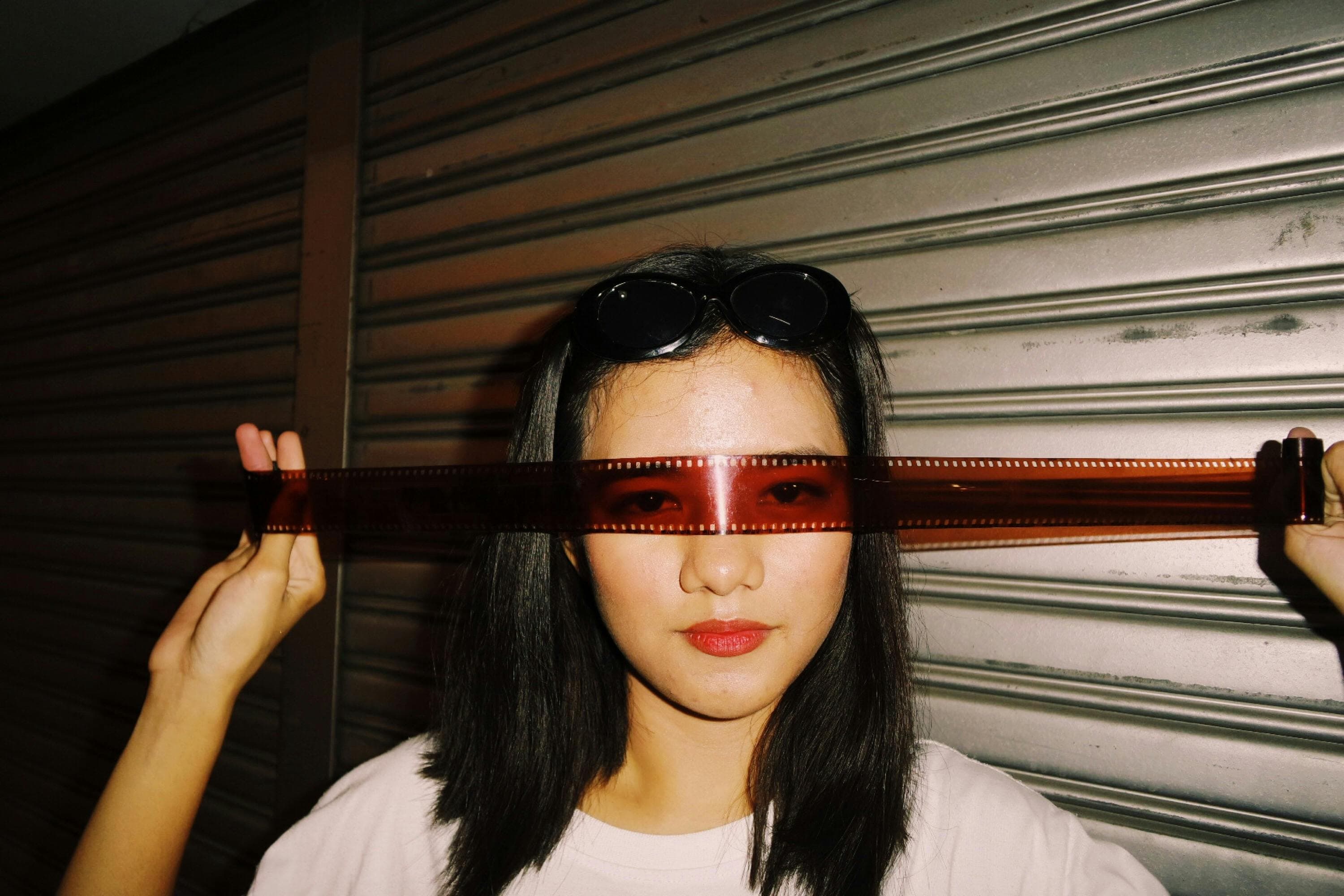 A person wearing dark sunglasses to protect their eyes after dilation