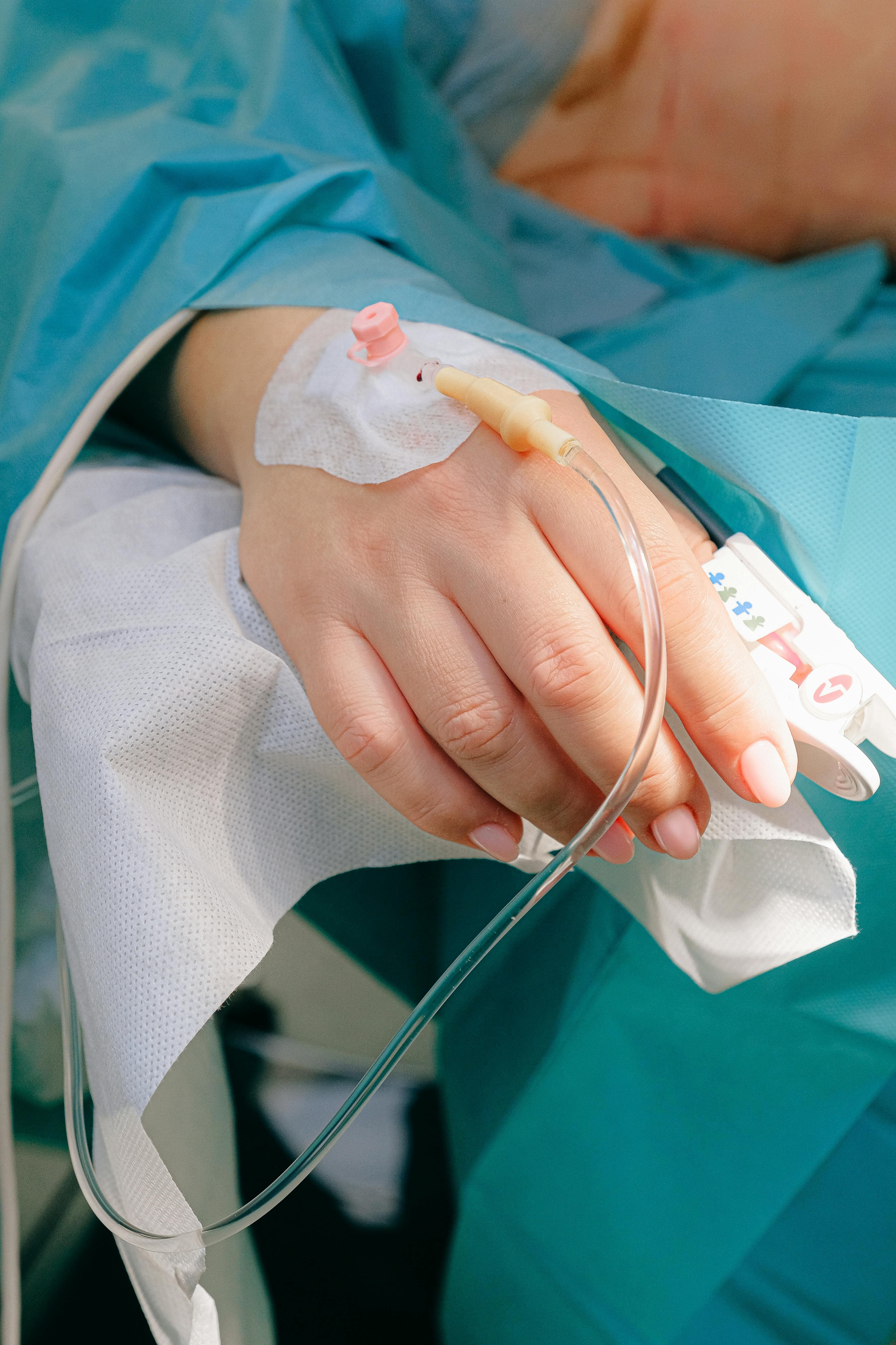 Doctor performing an eye infusion treatment on a patient