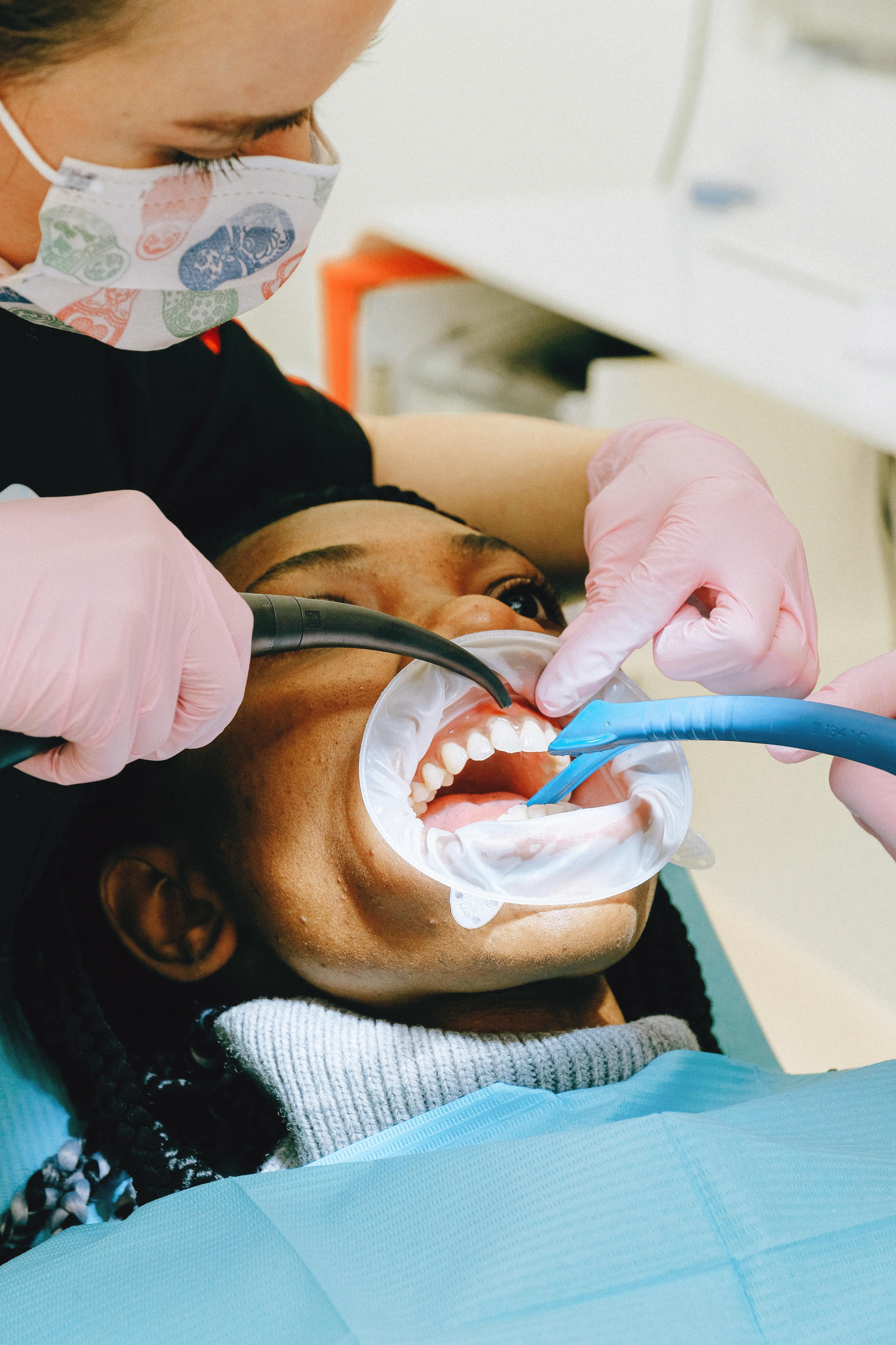 Dentist examining patient's gums for signs of oral health issues