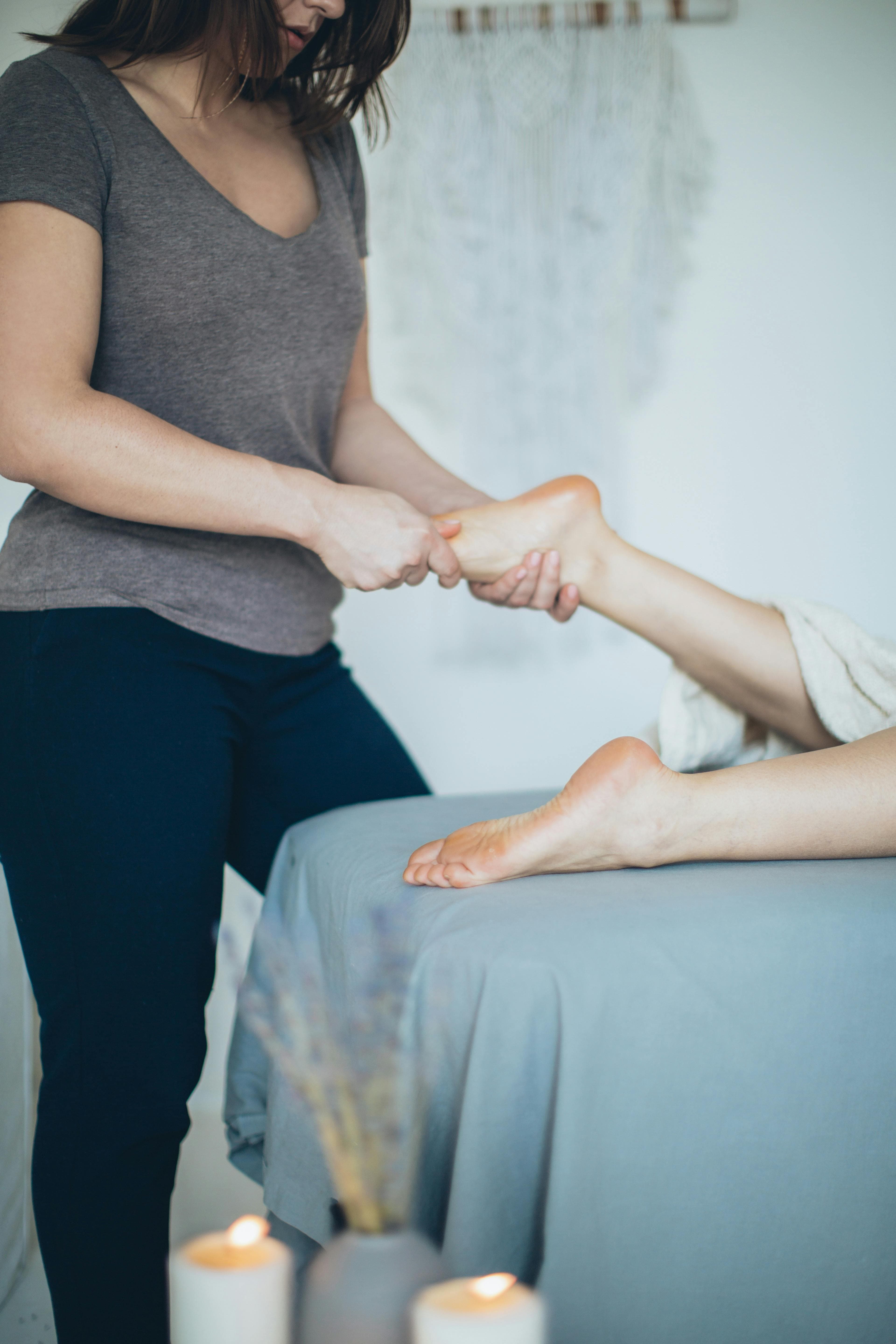 Person inspecting their feet as part of a regular foot care routine