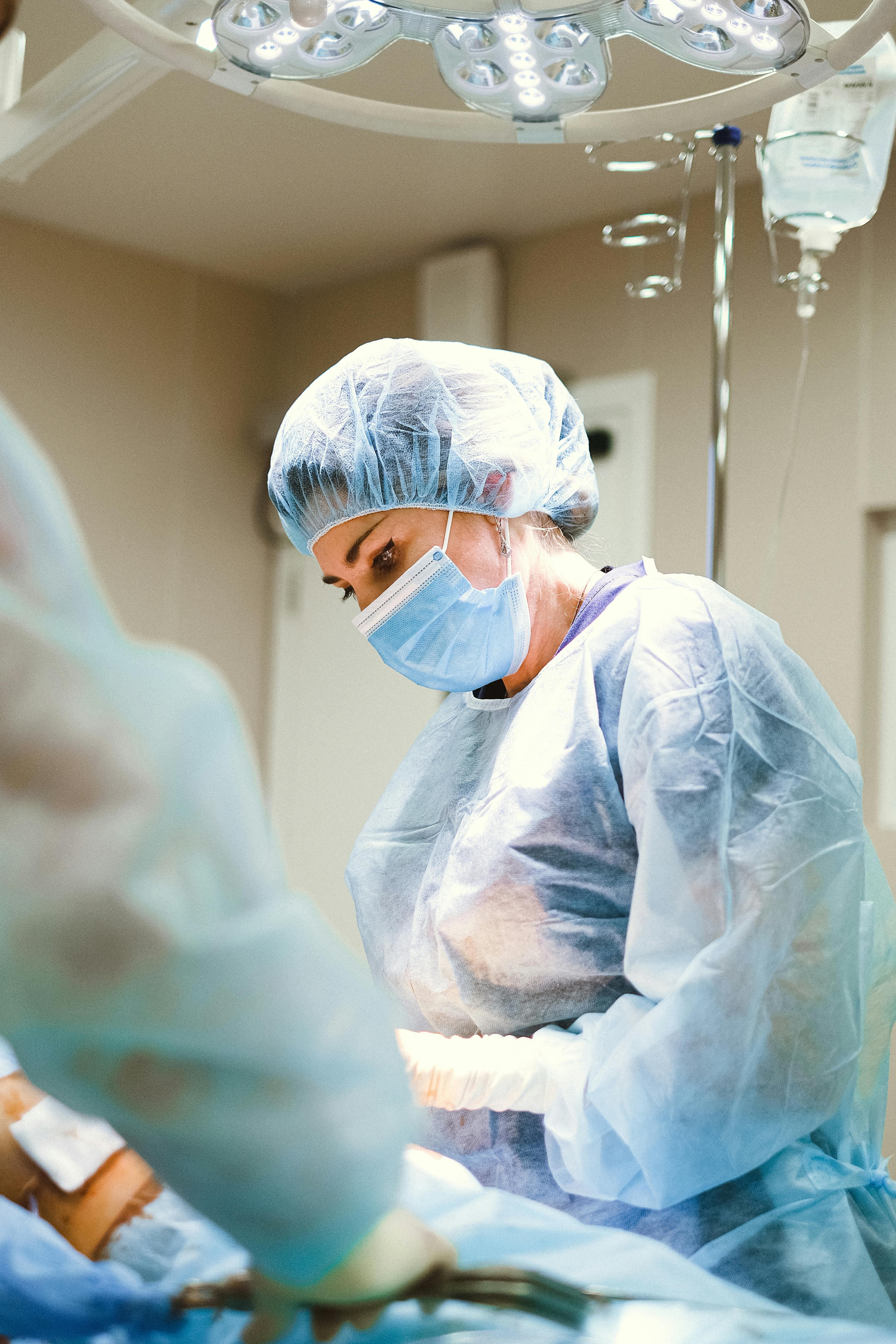 Surgeon performing vitreoretinal surgery using advanced equipment