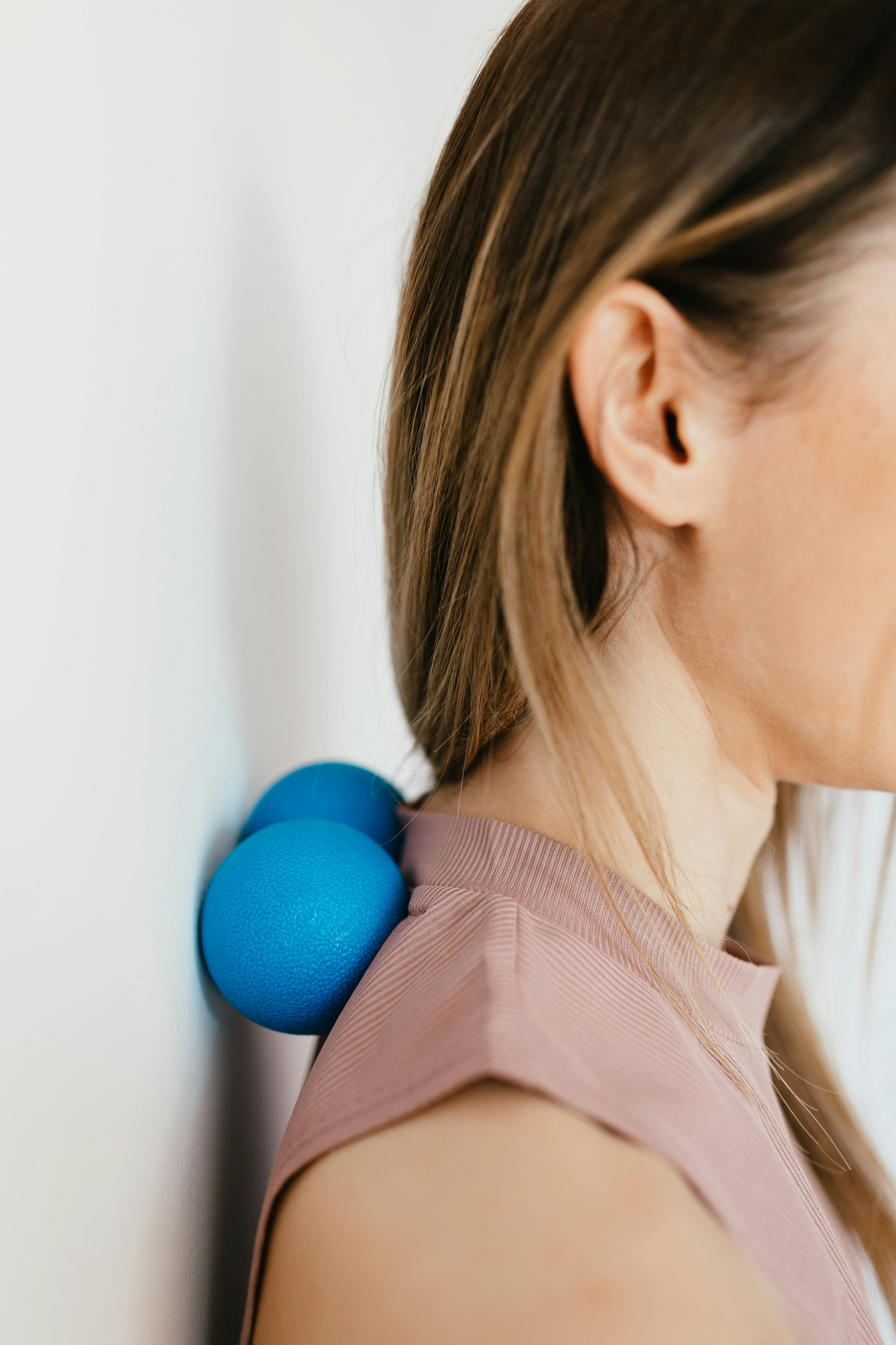 Person demonstrating deep breathing exercise for shoulder pain relief