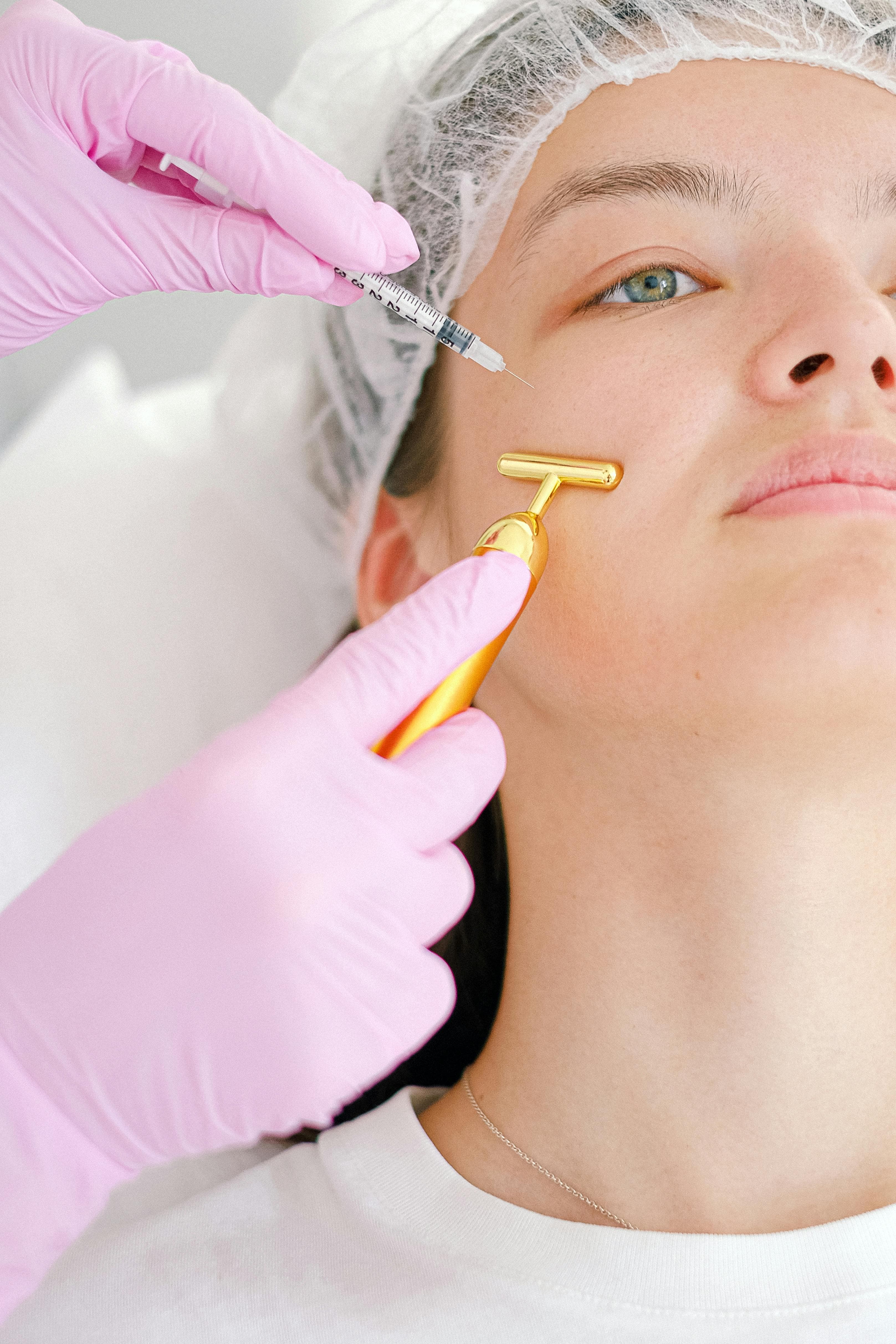 Doctor administering Botox injection near the eye area