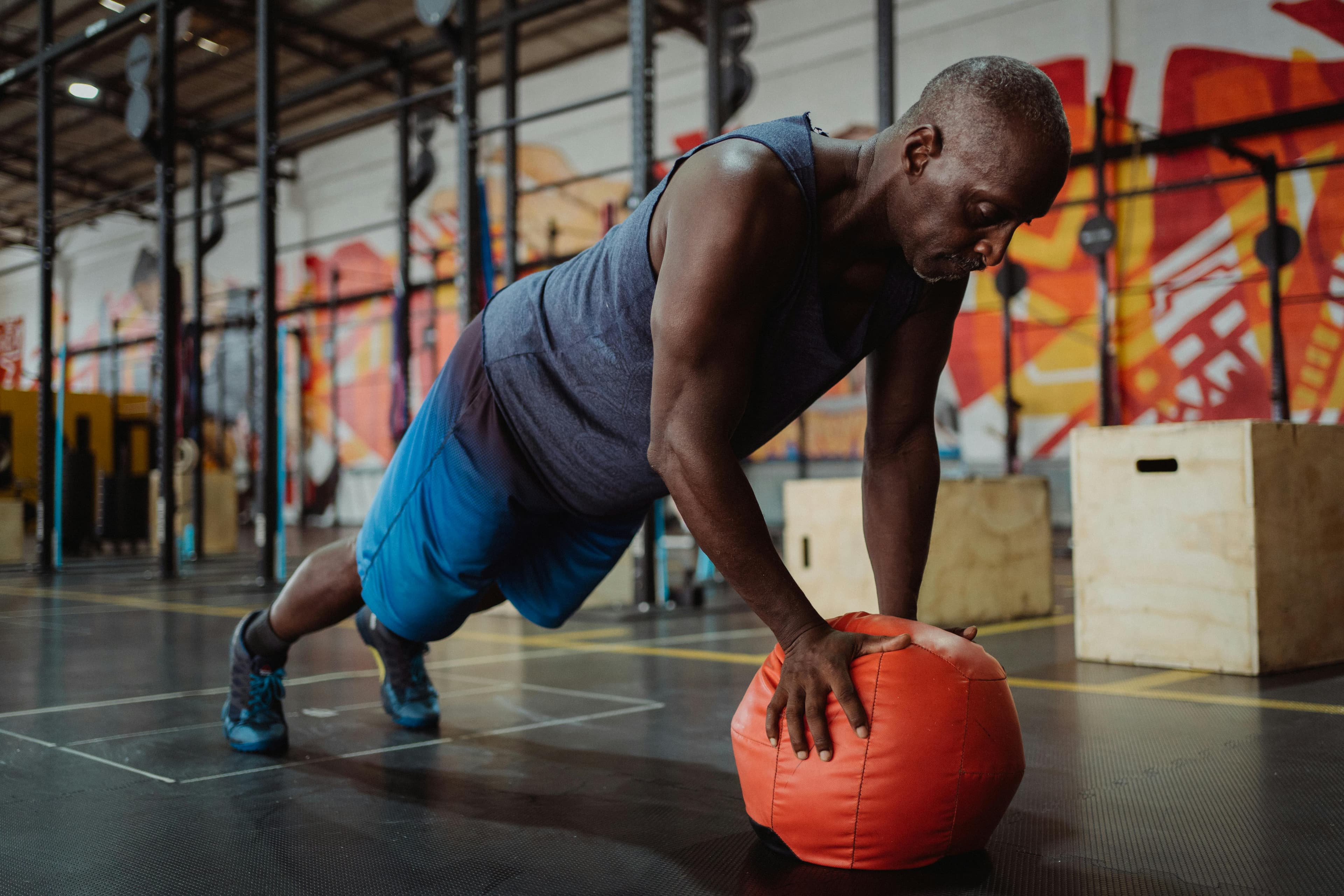 Person performing core strengthening exercises under guidance of a physical therapist