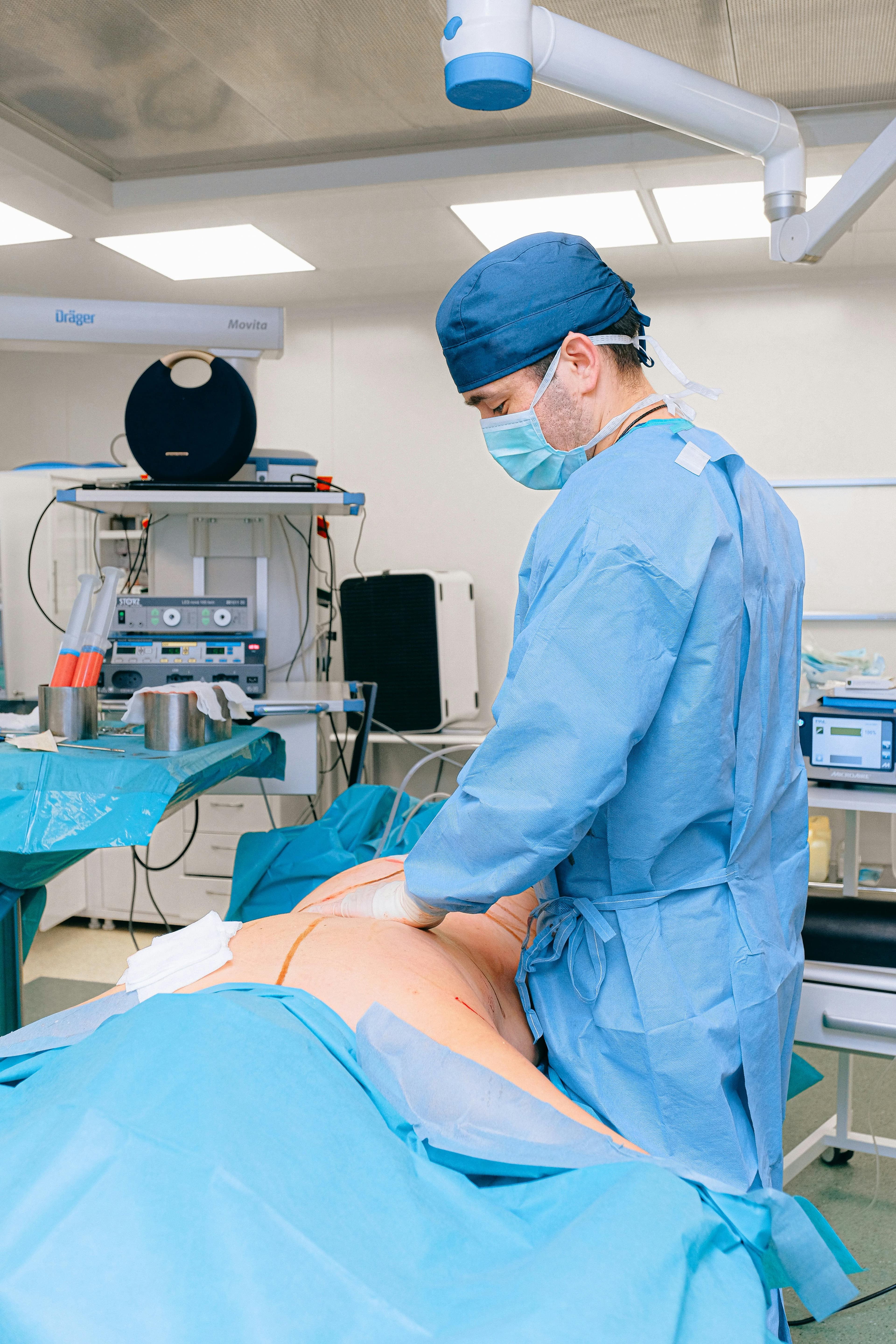 Surgeon performing arthroscopic shoulder surgery with a collagen patch