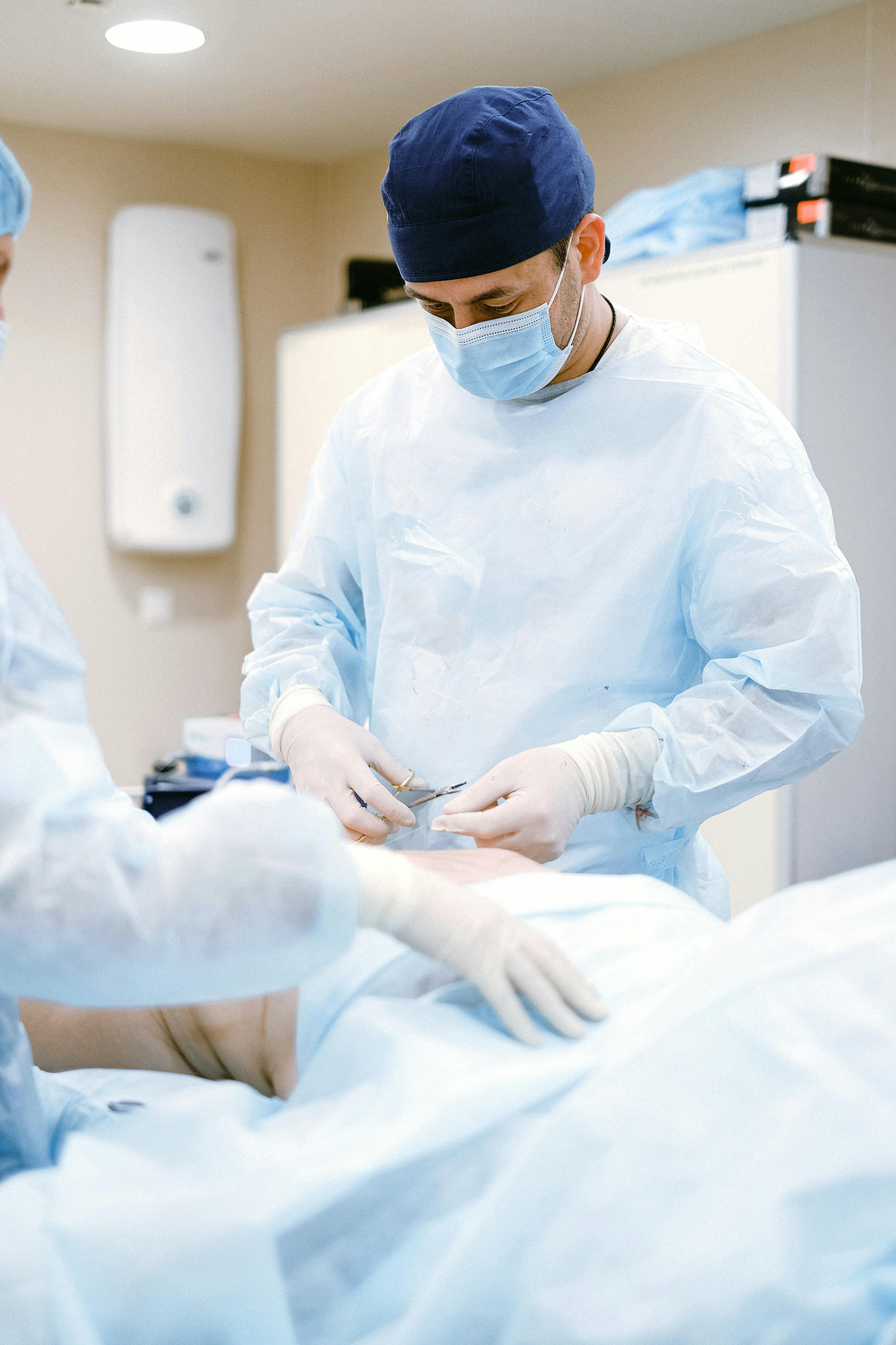 A surgeon performing a bone graft procedure in an operating room