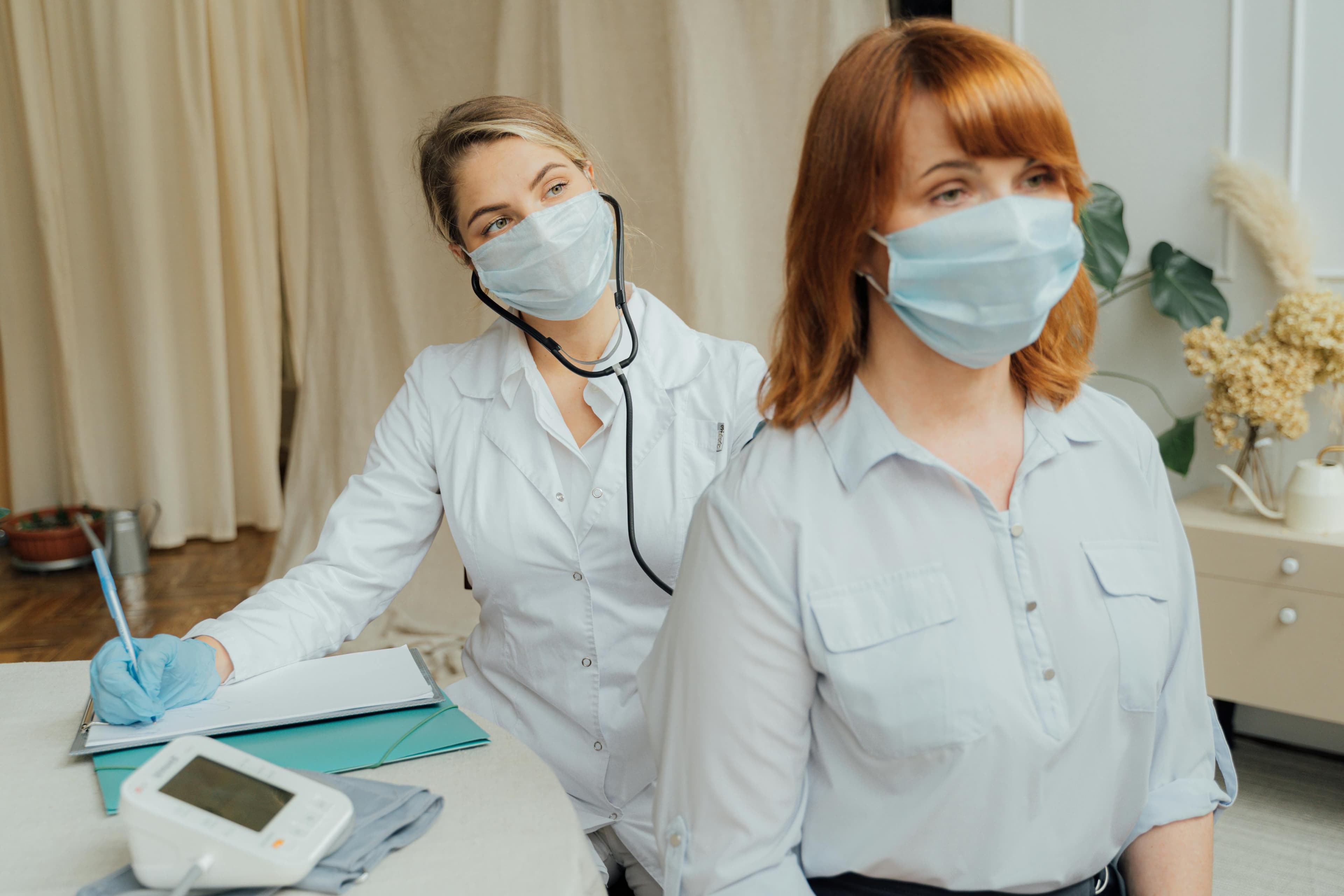 Workers wearing protective gear in an industrial setting, demonstrating proper safety measures for asthma prevention