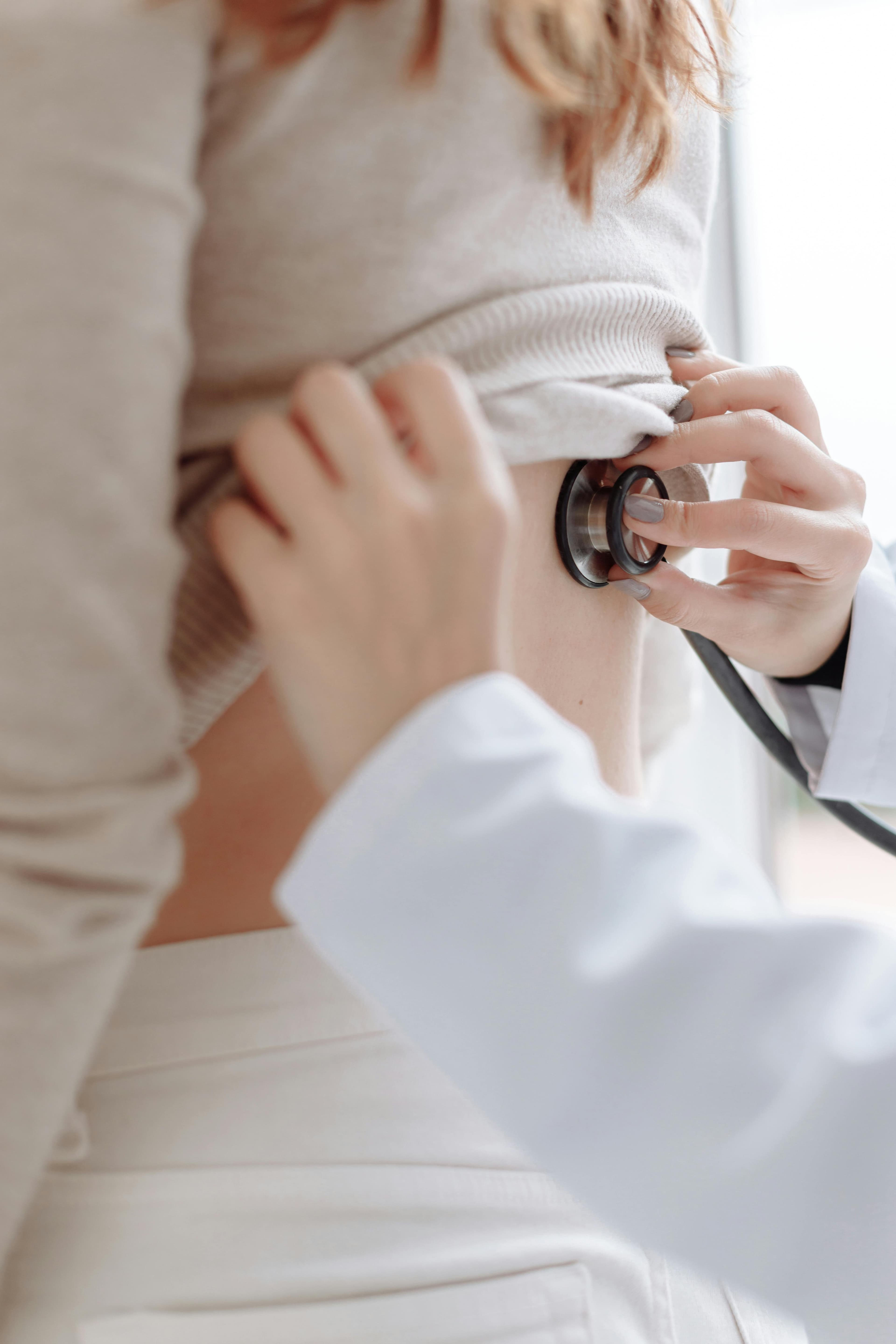 Doctor performing a corneal sensitivity test on a patient using an esthesiometer