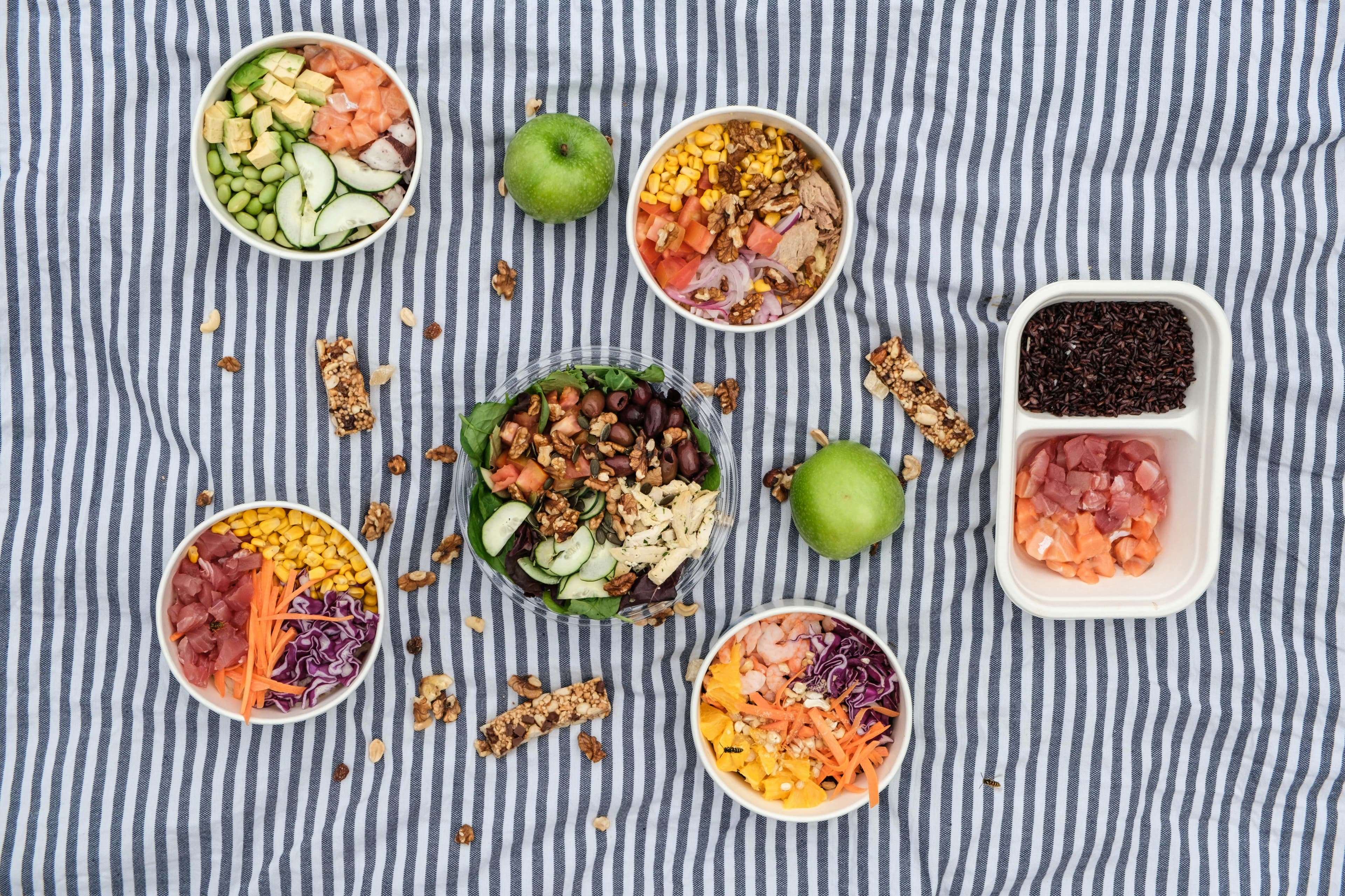 A plate filled with a variety of colorful fruits, vegetables, and lean proteins