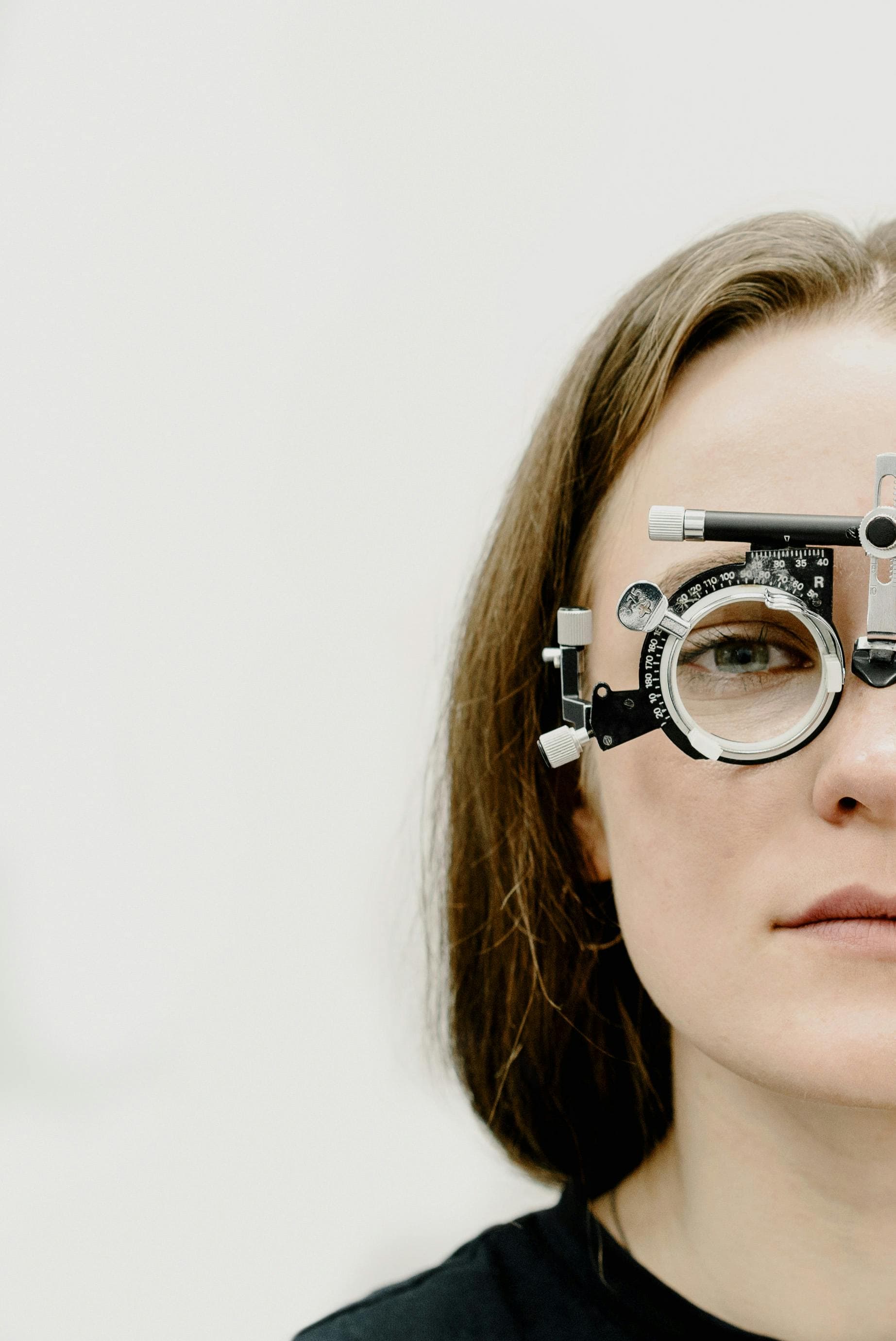 Eye doctor examining a patient's eyes for contact lens fitting