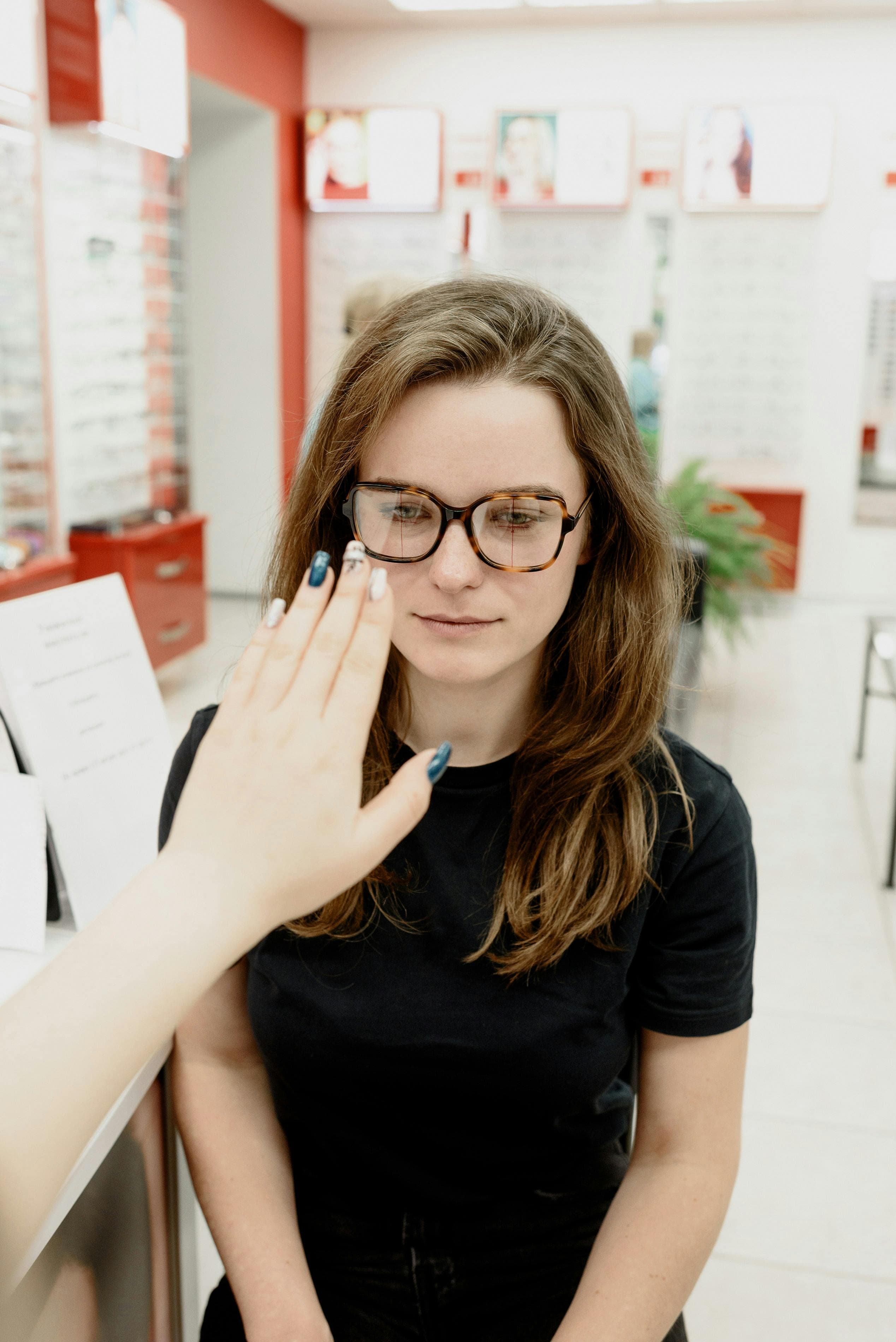 Eye care professional fitting a high cylinder contact lens on a patient
