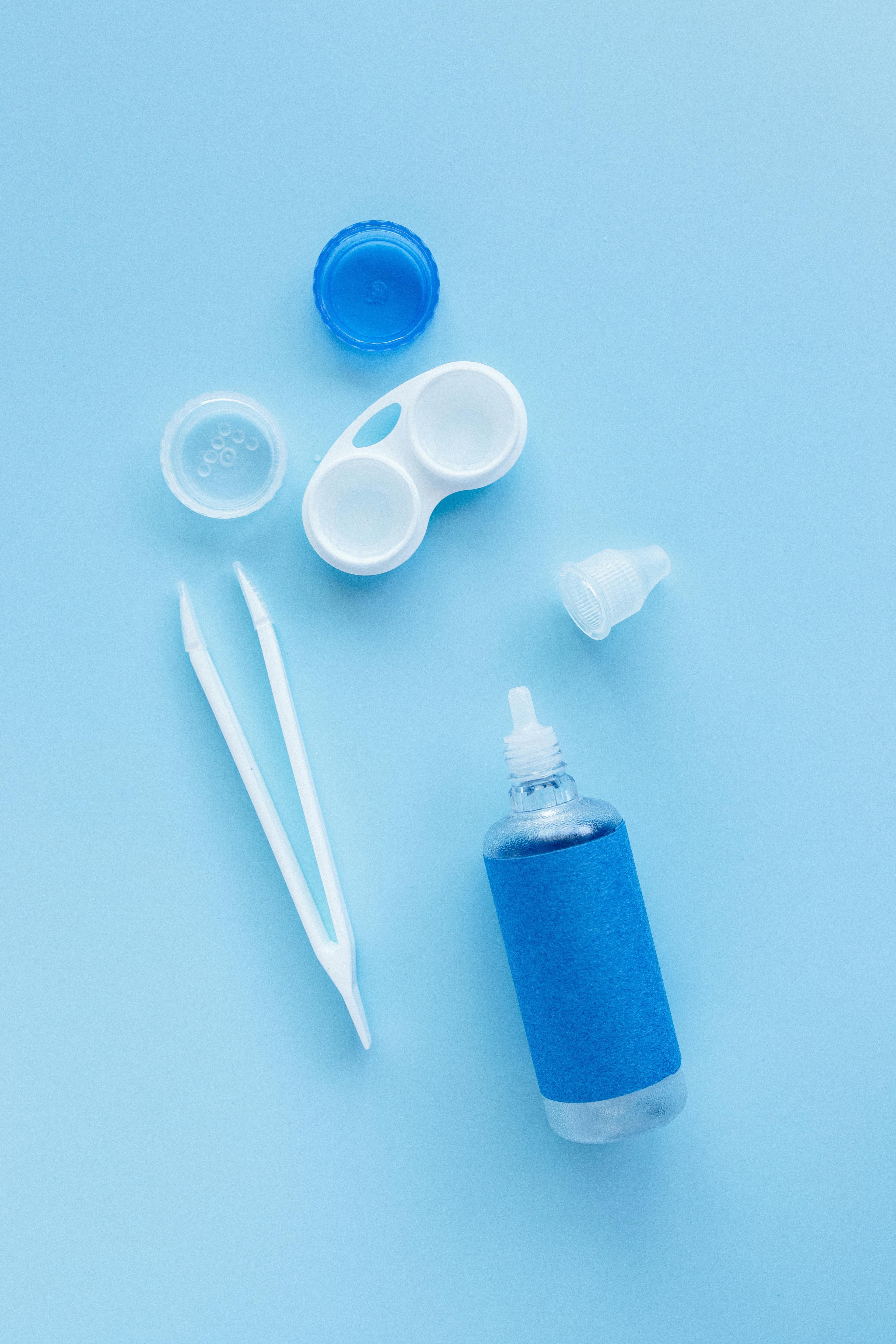 A bottle of Lumify eye drops next to an open eye