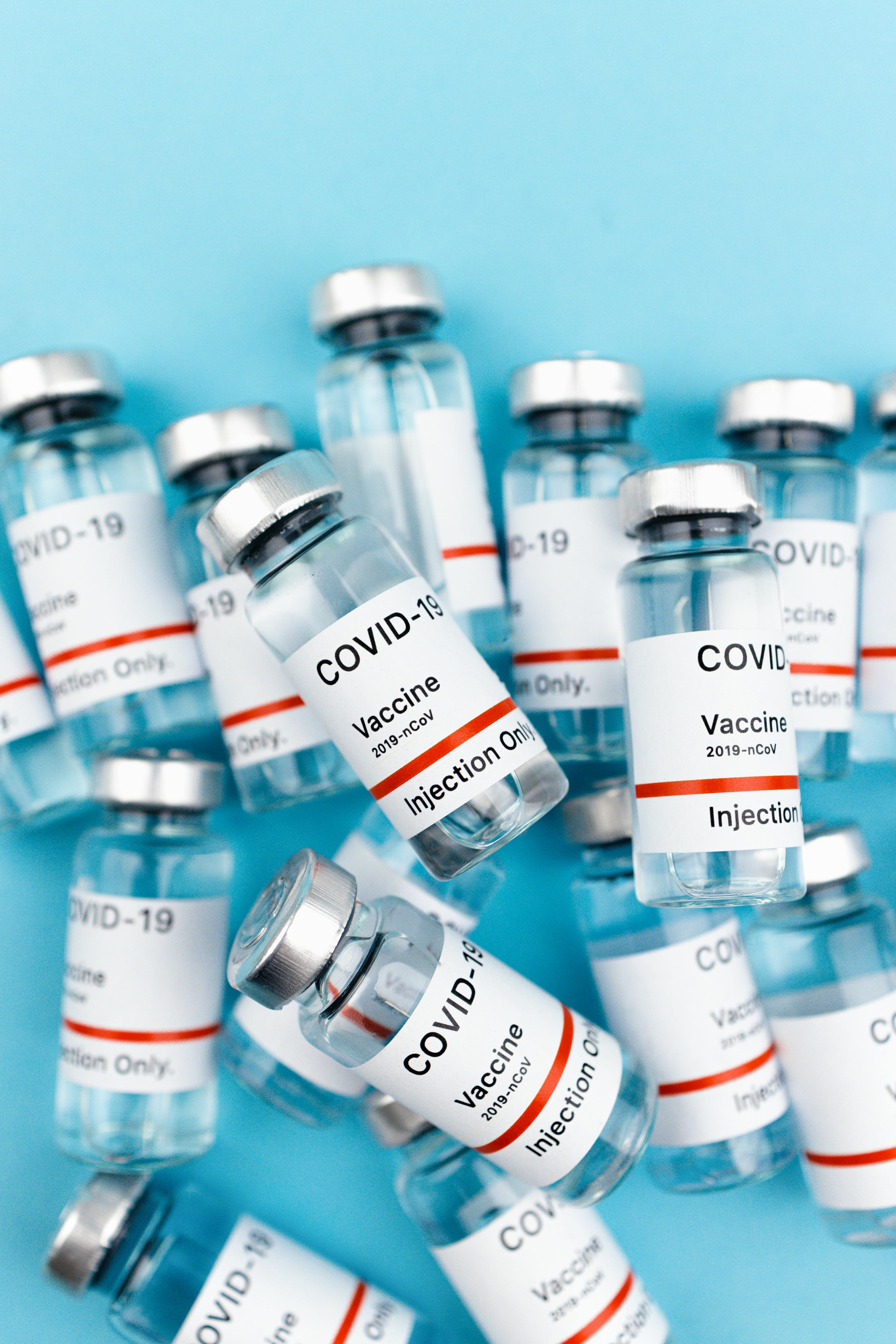 Bottles of minoxidil solution and PRP injection vials