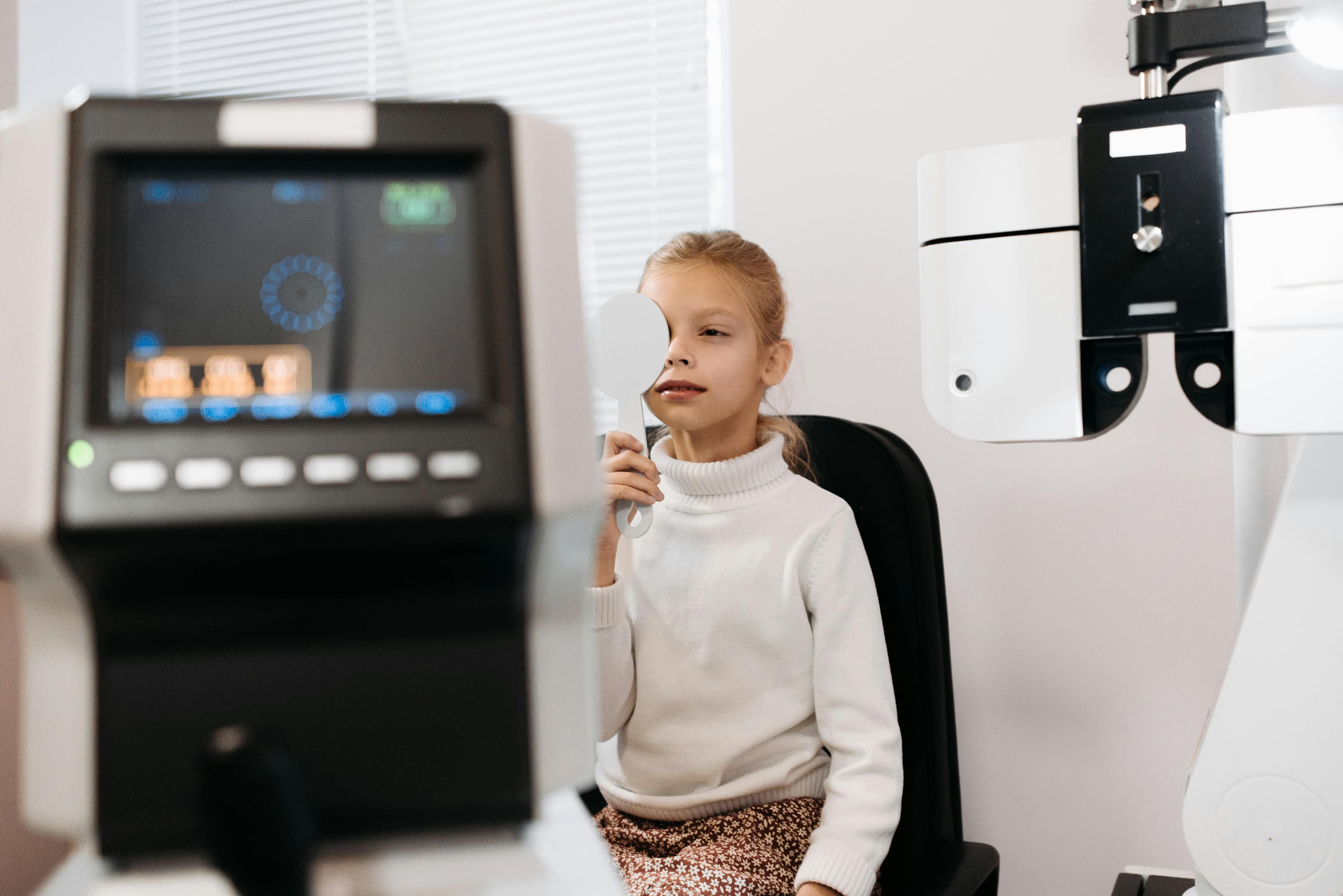 Eye doctor performing an ocular surface examination on a patient with glaucoma