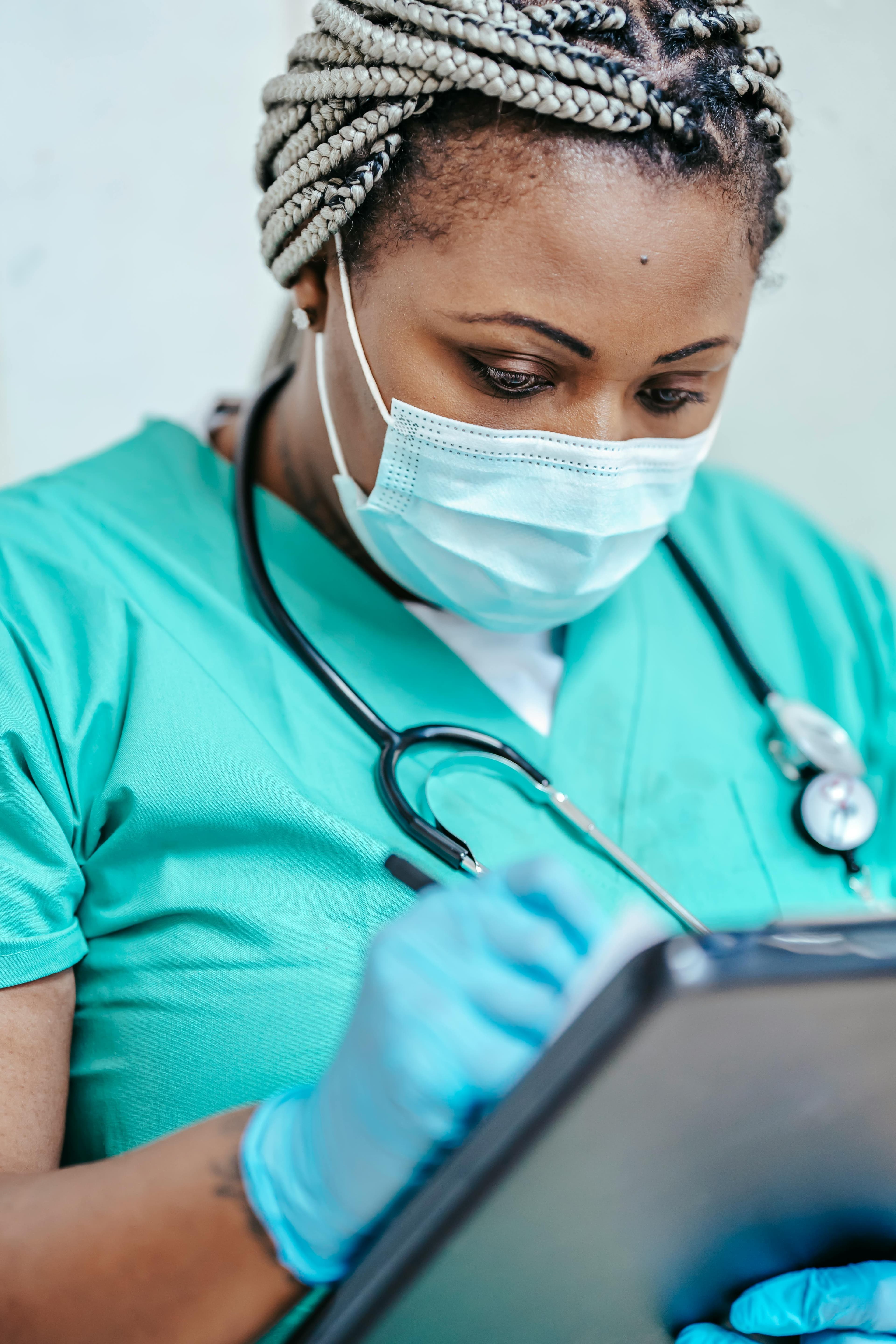 A healthcare professional reviewing medical codes and documentation
