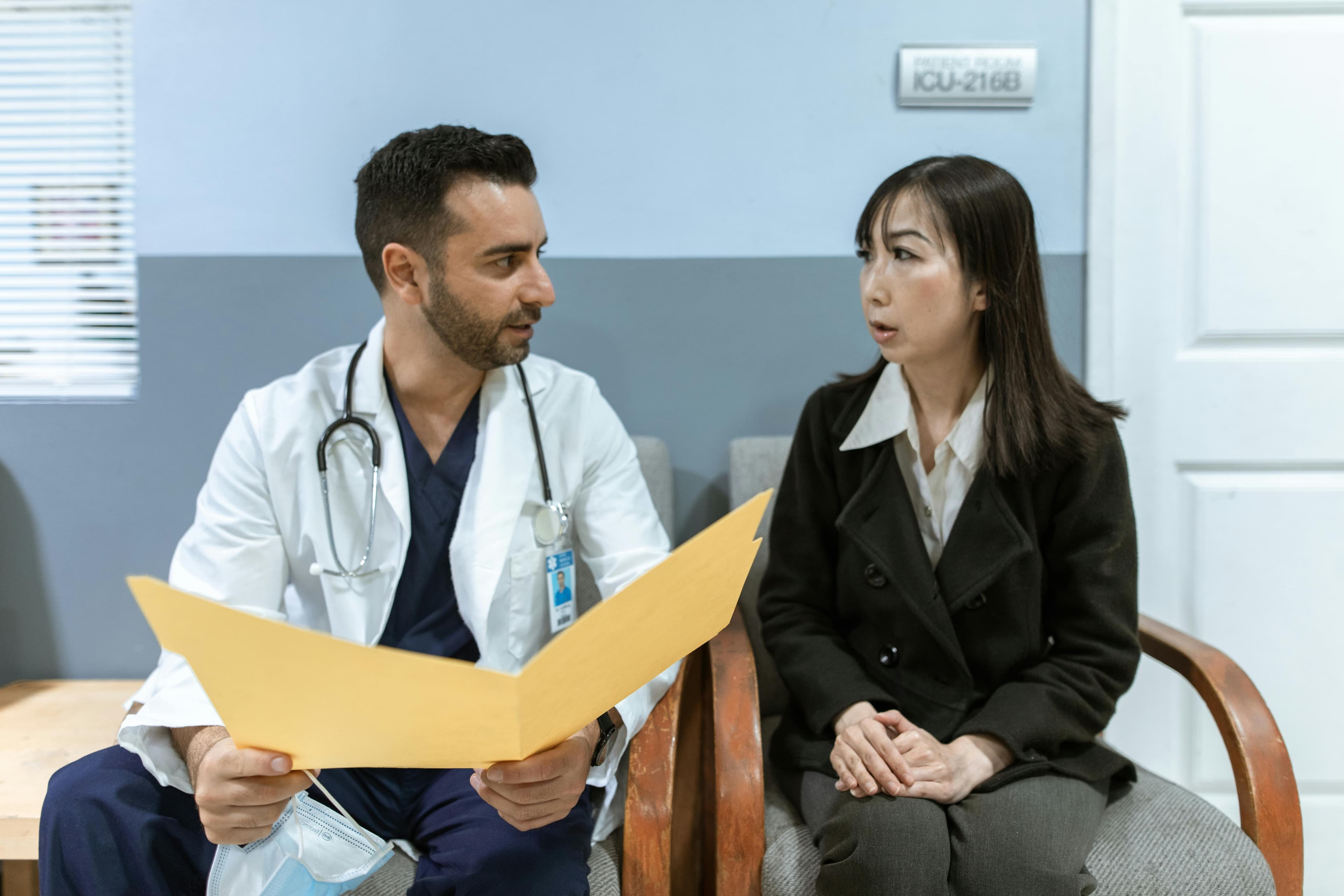 Medical team discussing patient case and correlating different diagnostic findings