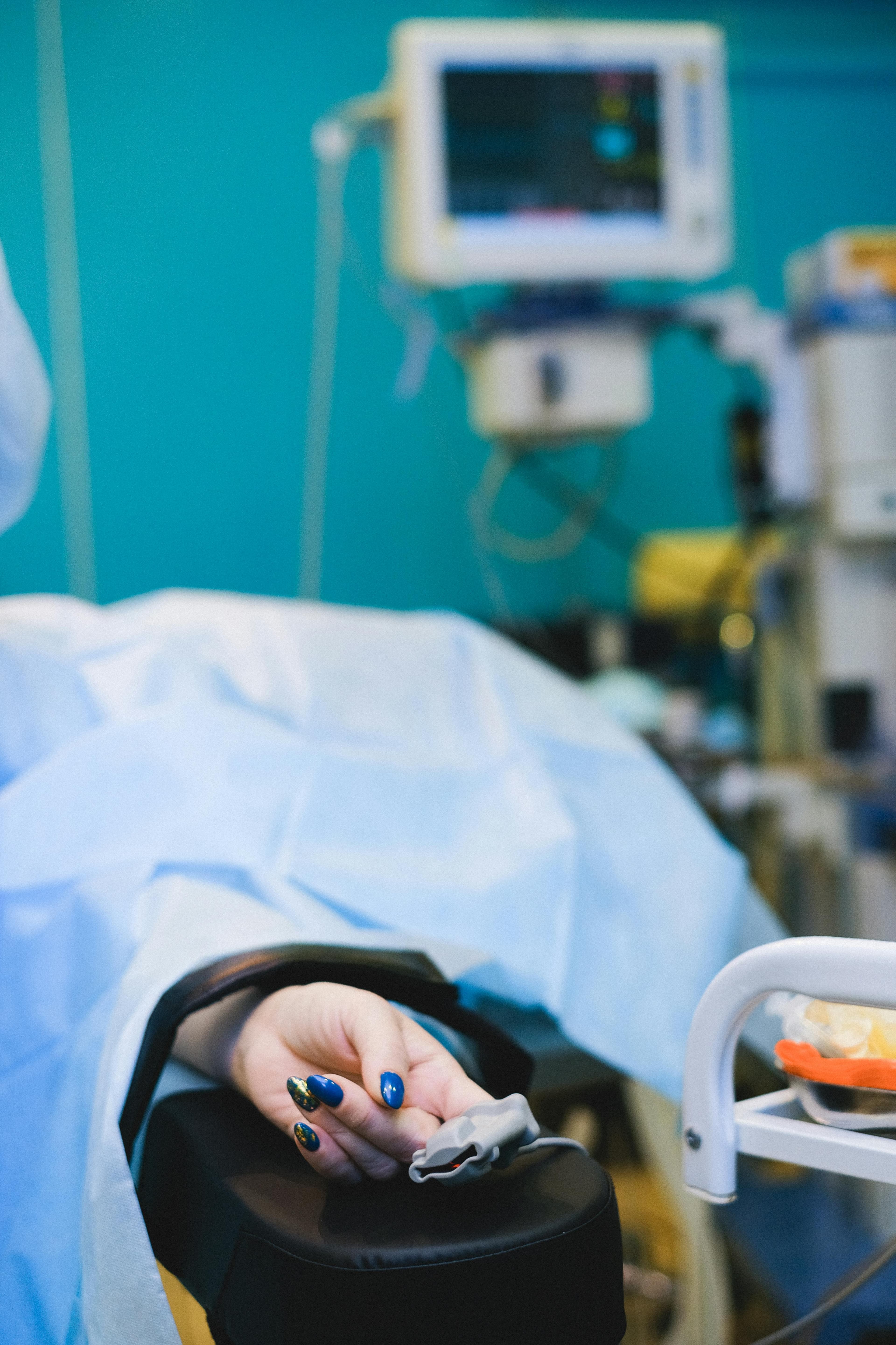 Doctor measuring patient's blood pressure before cataract surgery