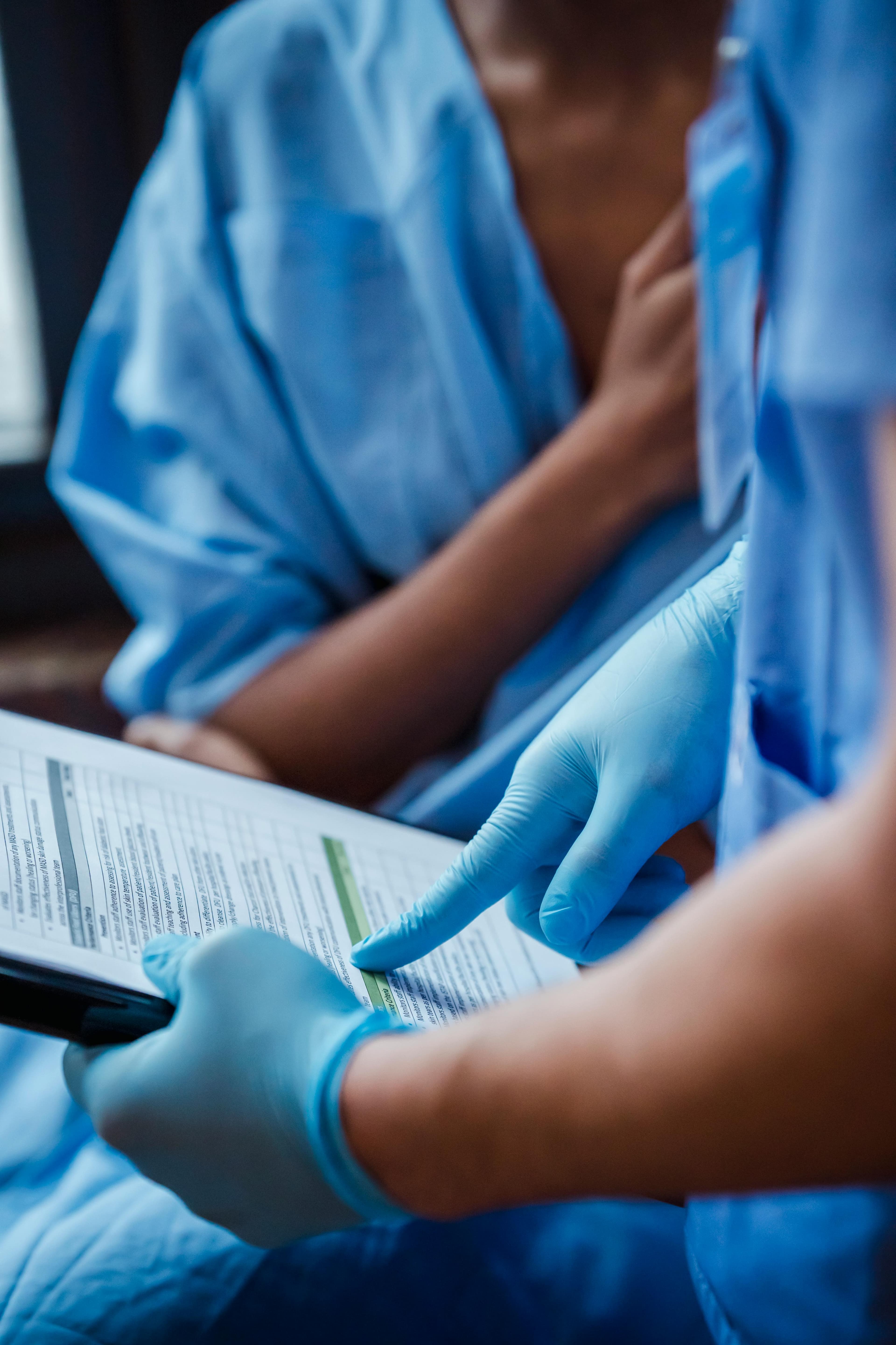A liver specialist examining medical charts and liver scans