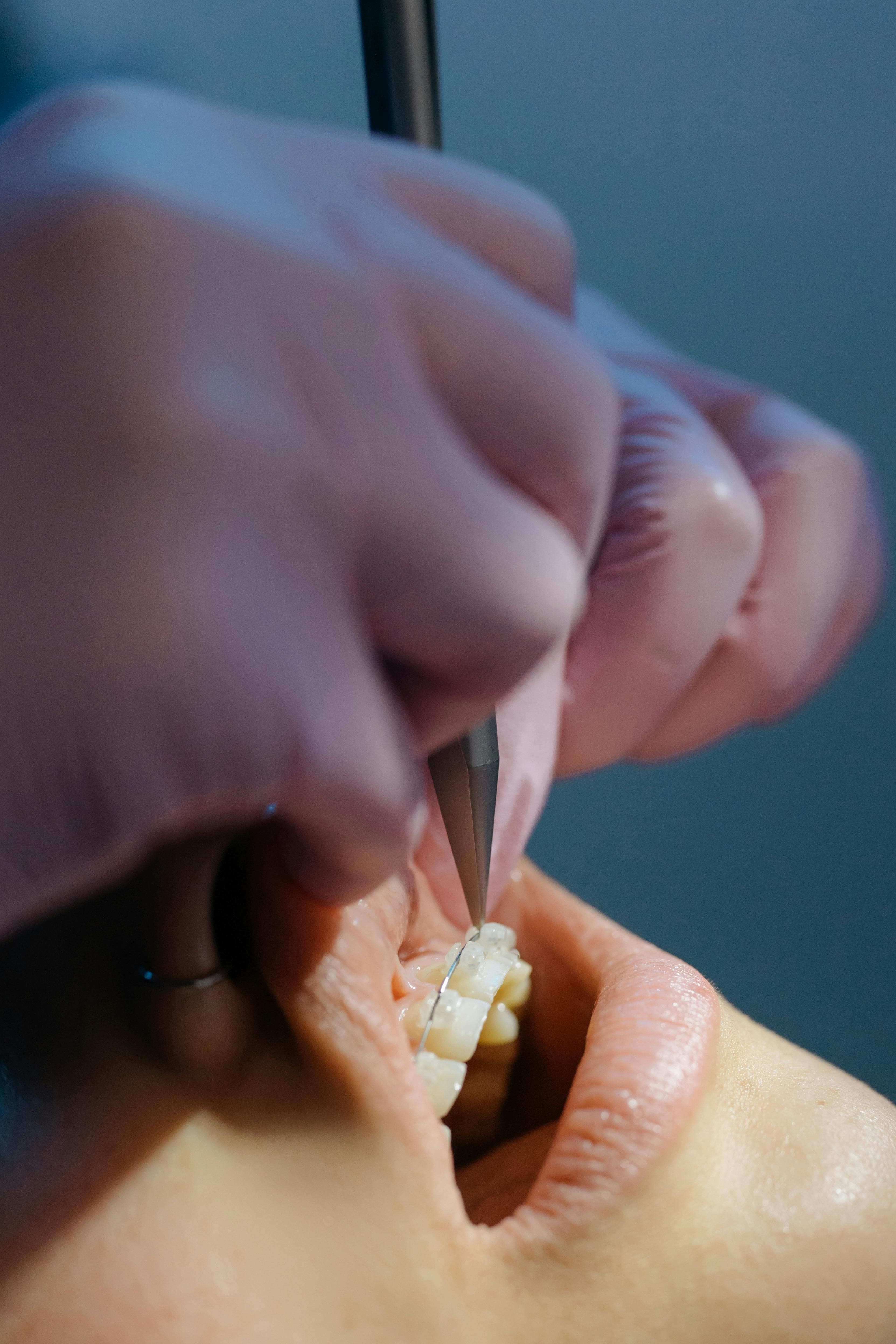 Doctor examining patient's jaw