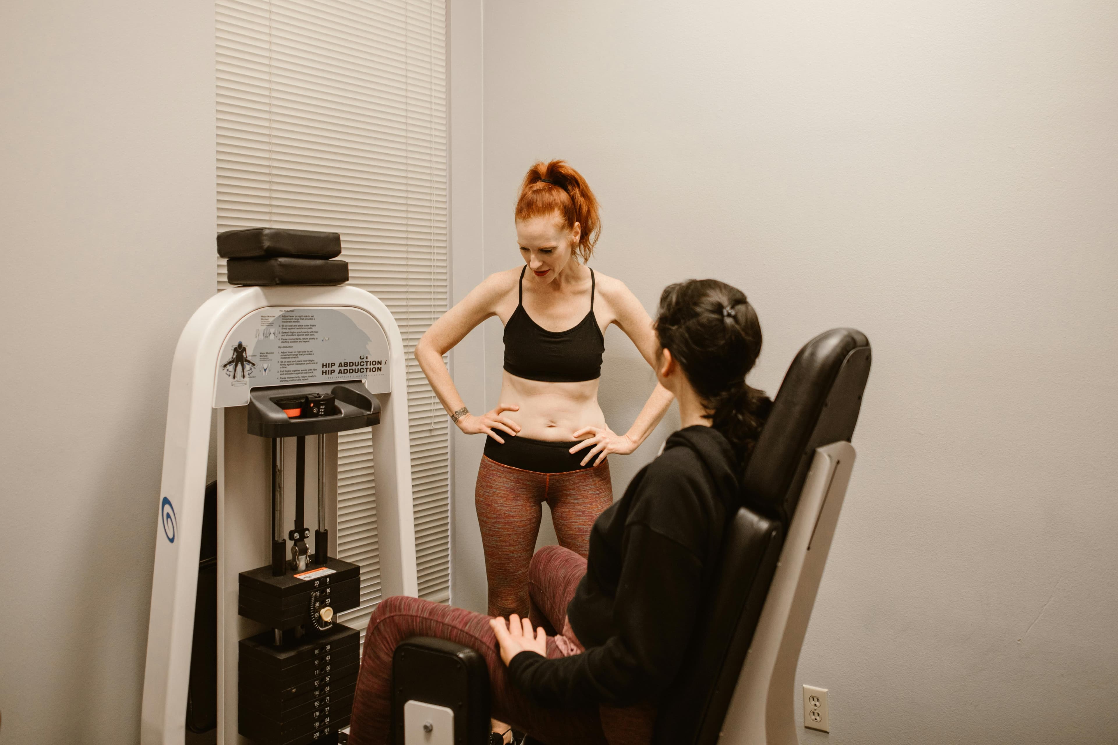 Athletic trainer applying supportive tape to an athlete's ankle
