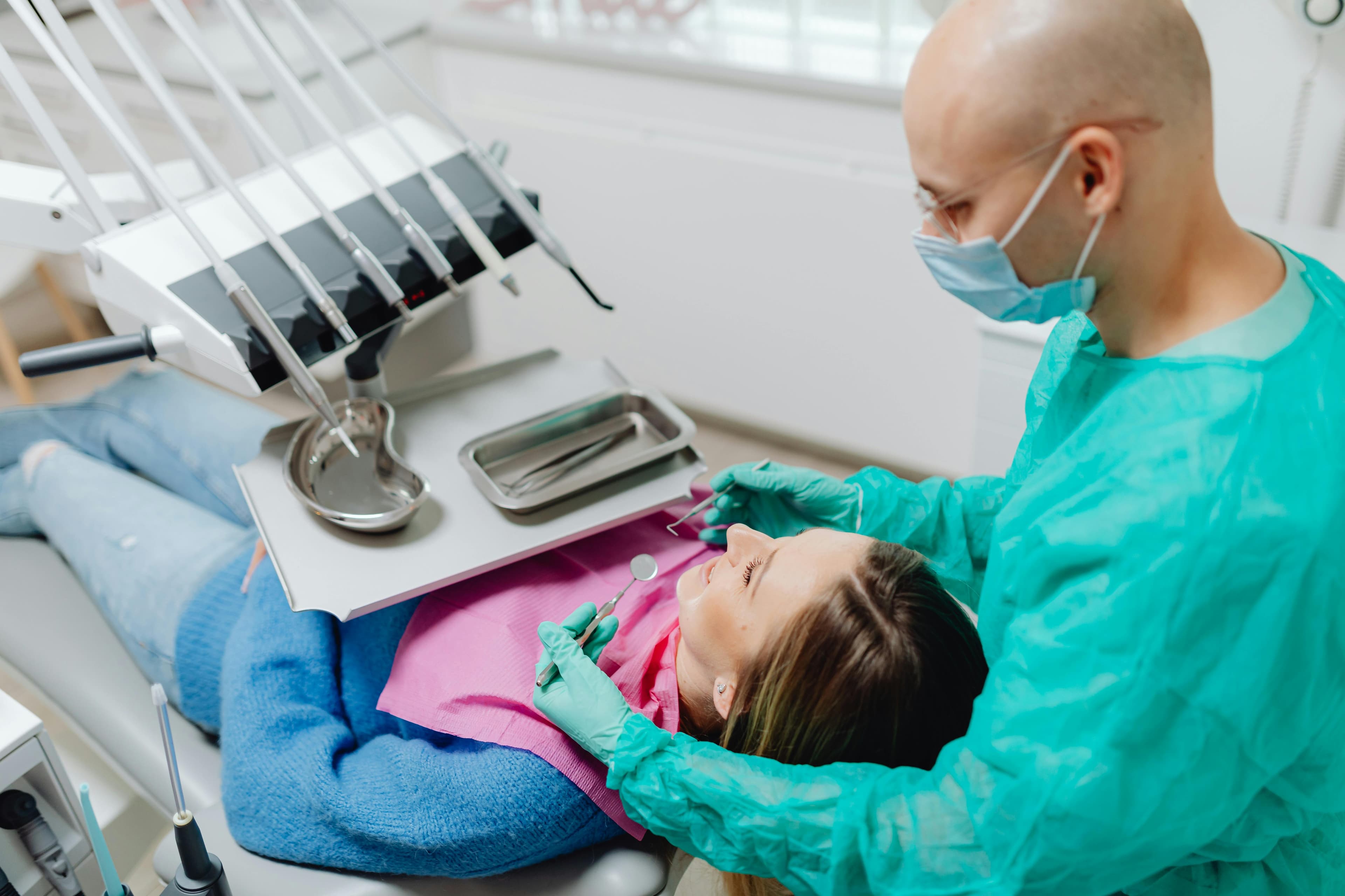 Doctor performing a proctology examination on a patient