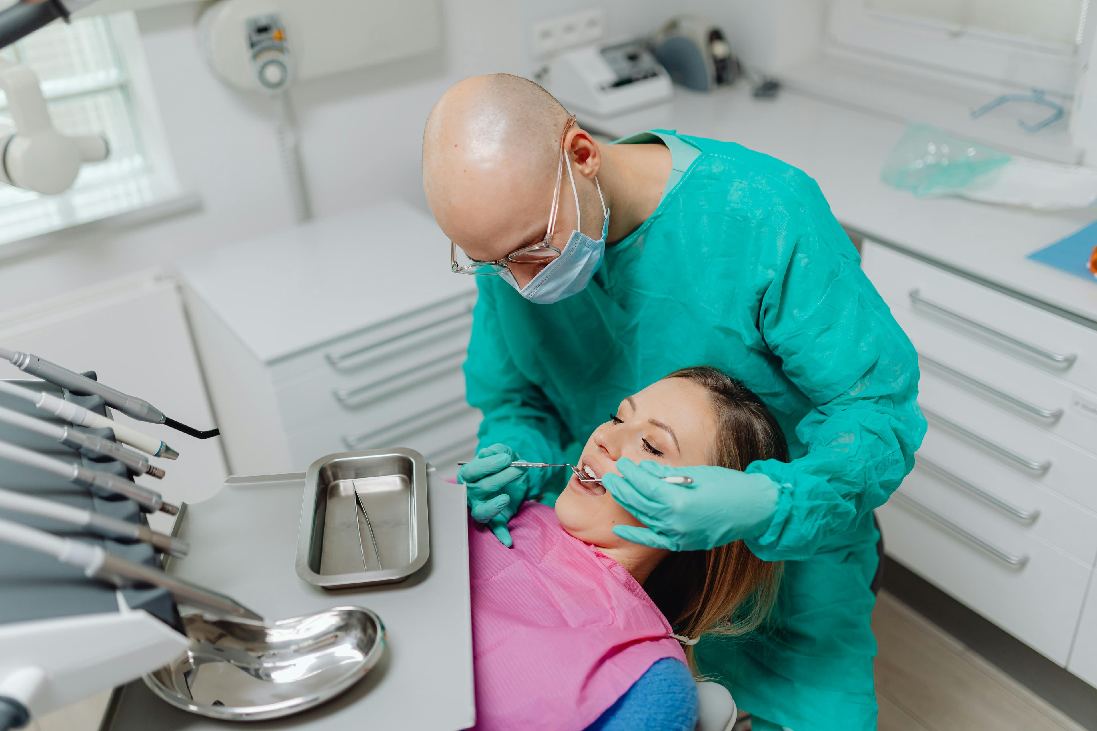 Doctor performing a hysteroscopy procedure on a patient