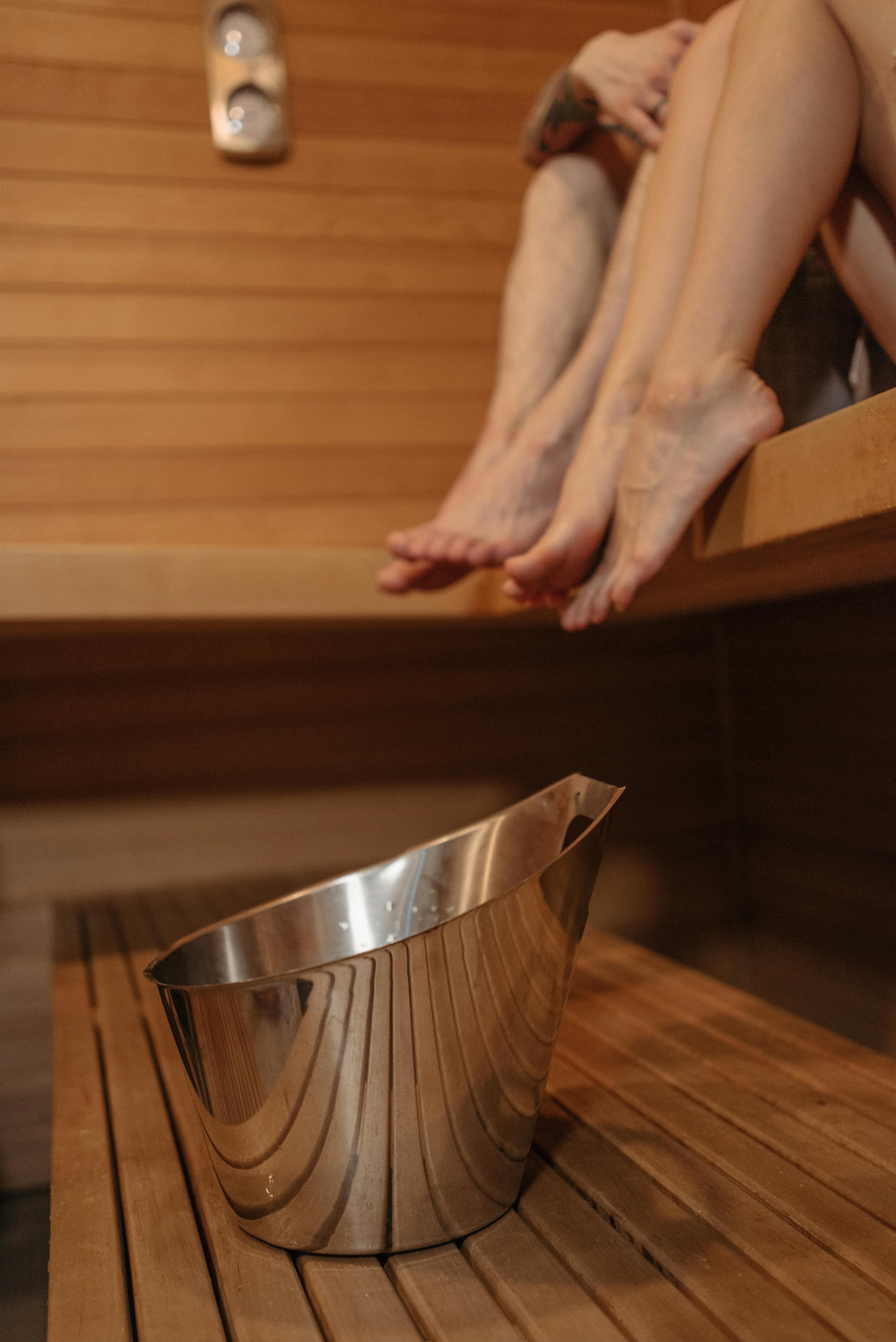 A person enjoying a warm shower with steam visible, illustrating potential benefits for respiratory symptoms
