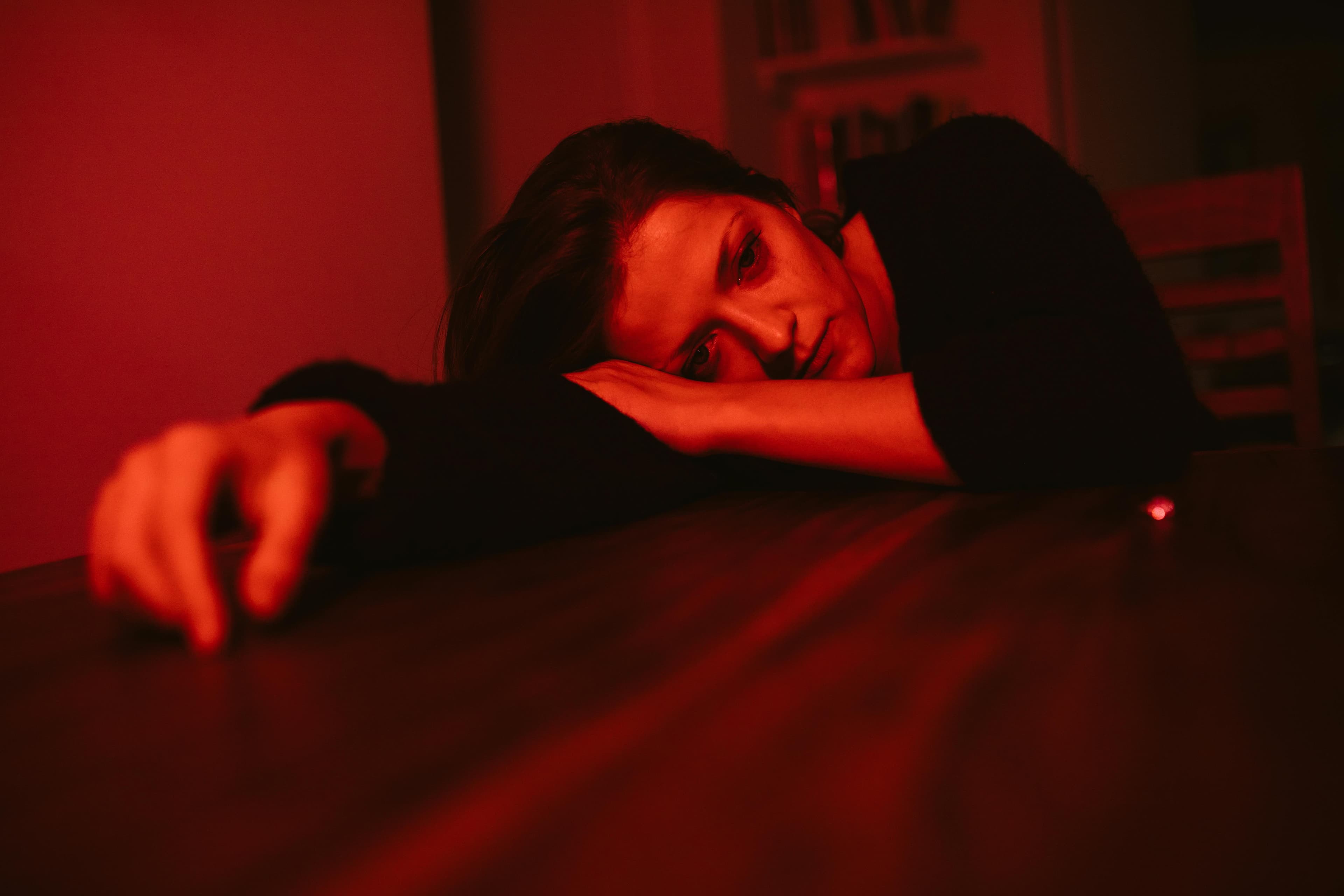 A person resting at home with ice pack on surgical site, illustrating recovery tips after lipoma removal