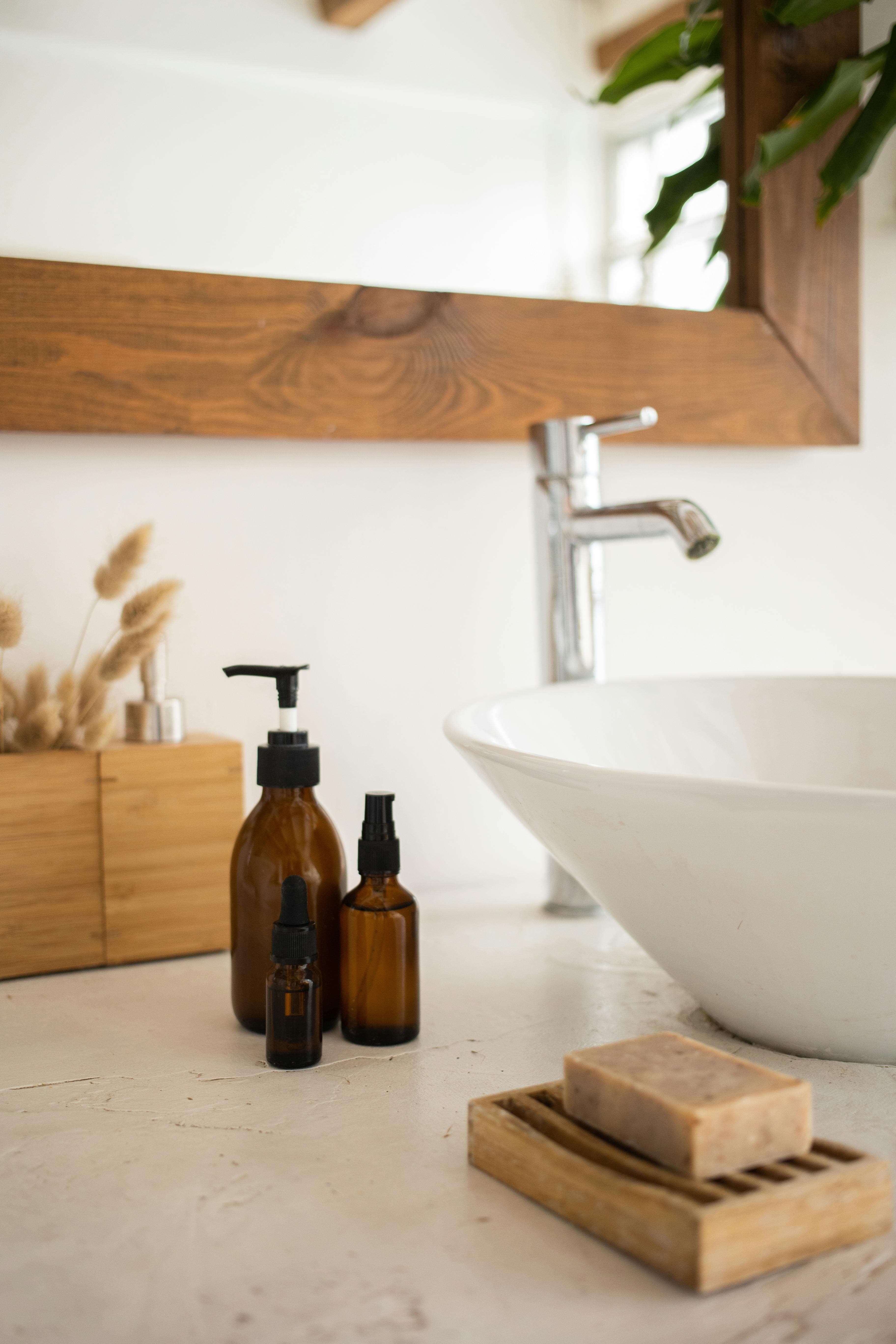 A bottle of iodine solution next to a foot basin