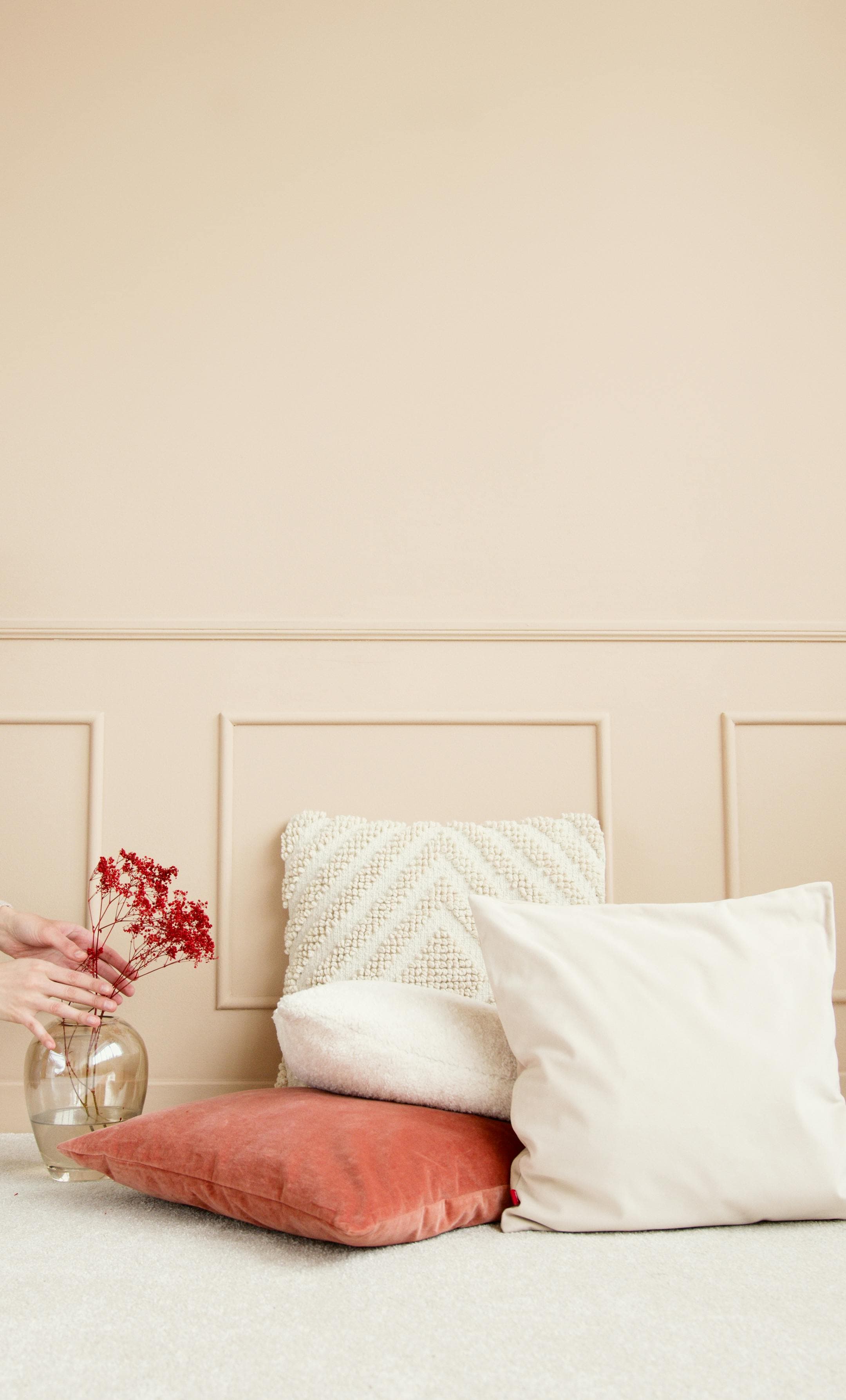 Darkened bedroom with comfortable bedding and white noise machine