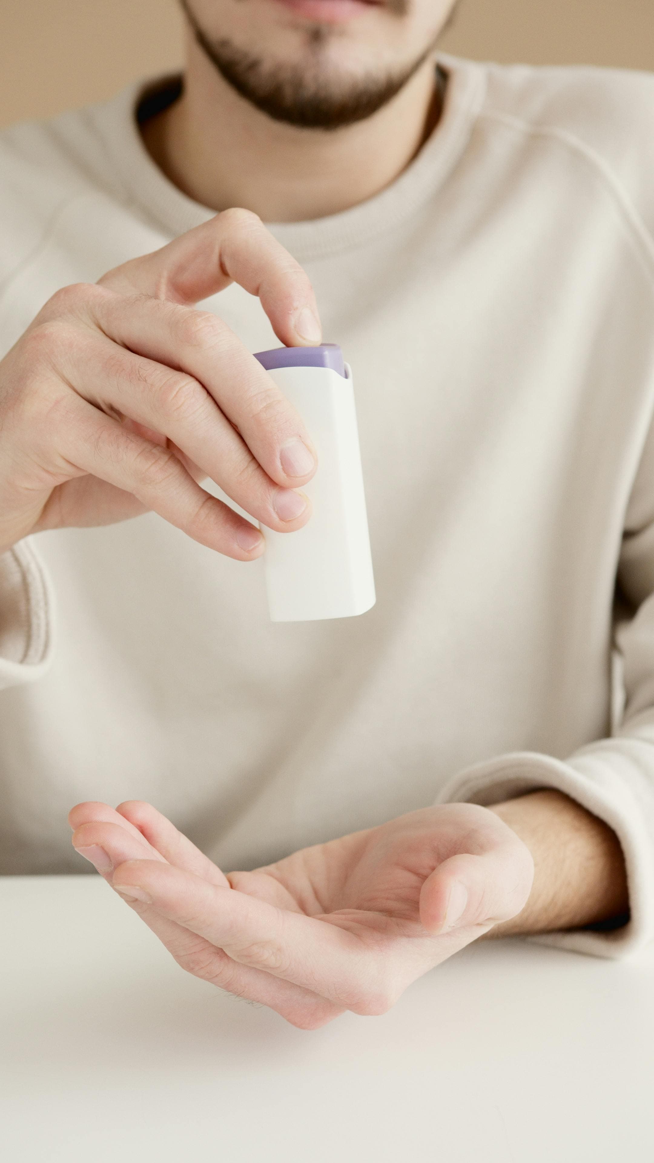 Person applying moisturizer to feet as part of a foot care routine