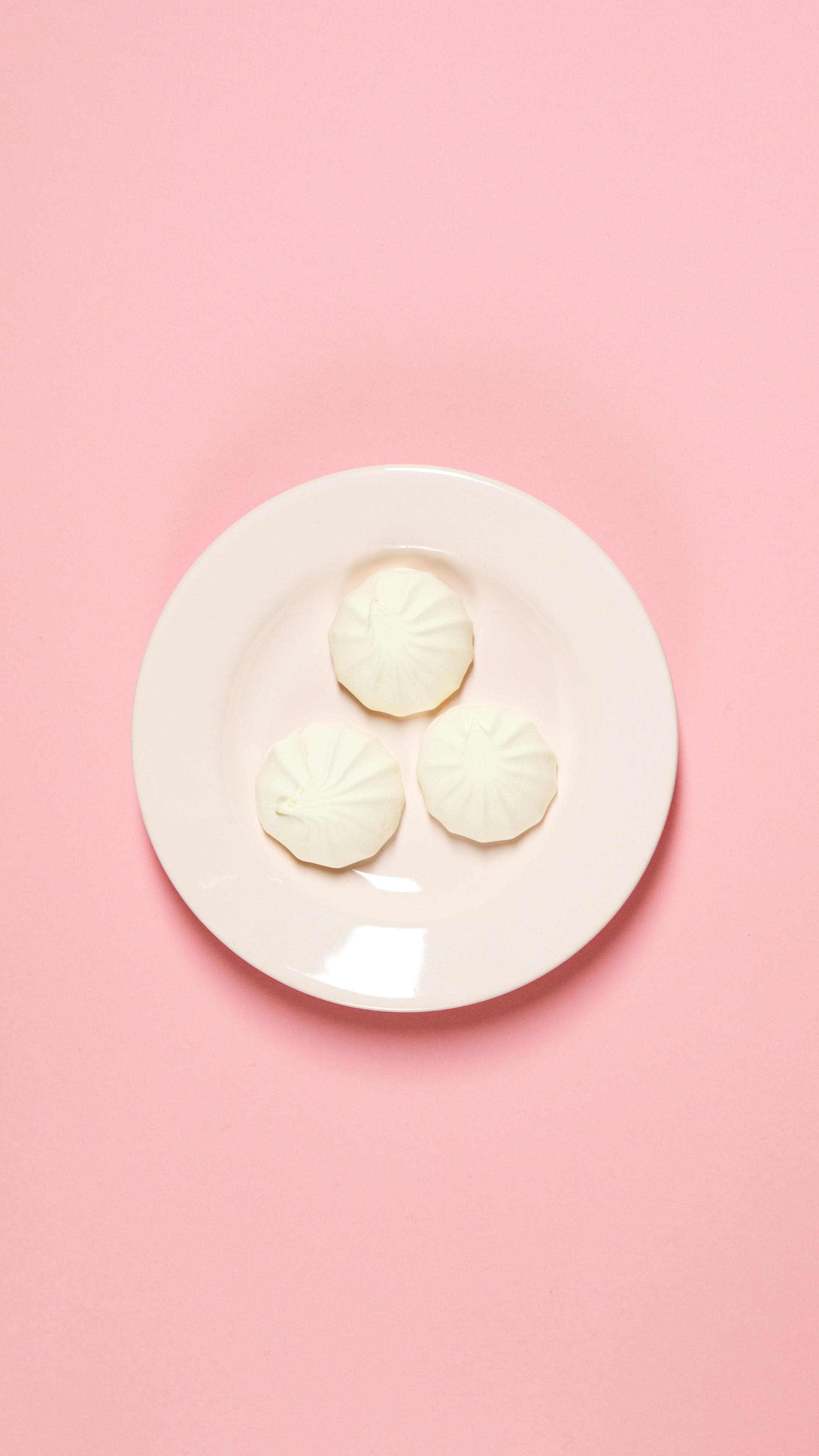 A plate with various unhealthy foods including processed meats, refined carbohydrates, and dairy products