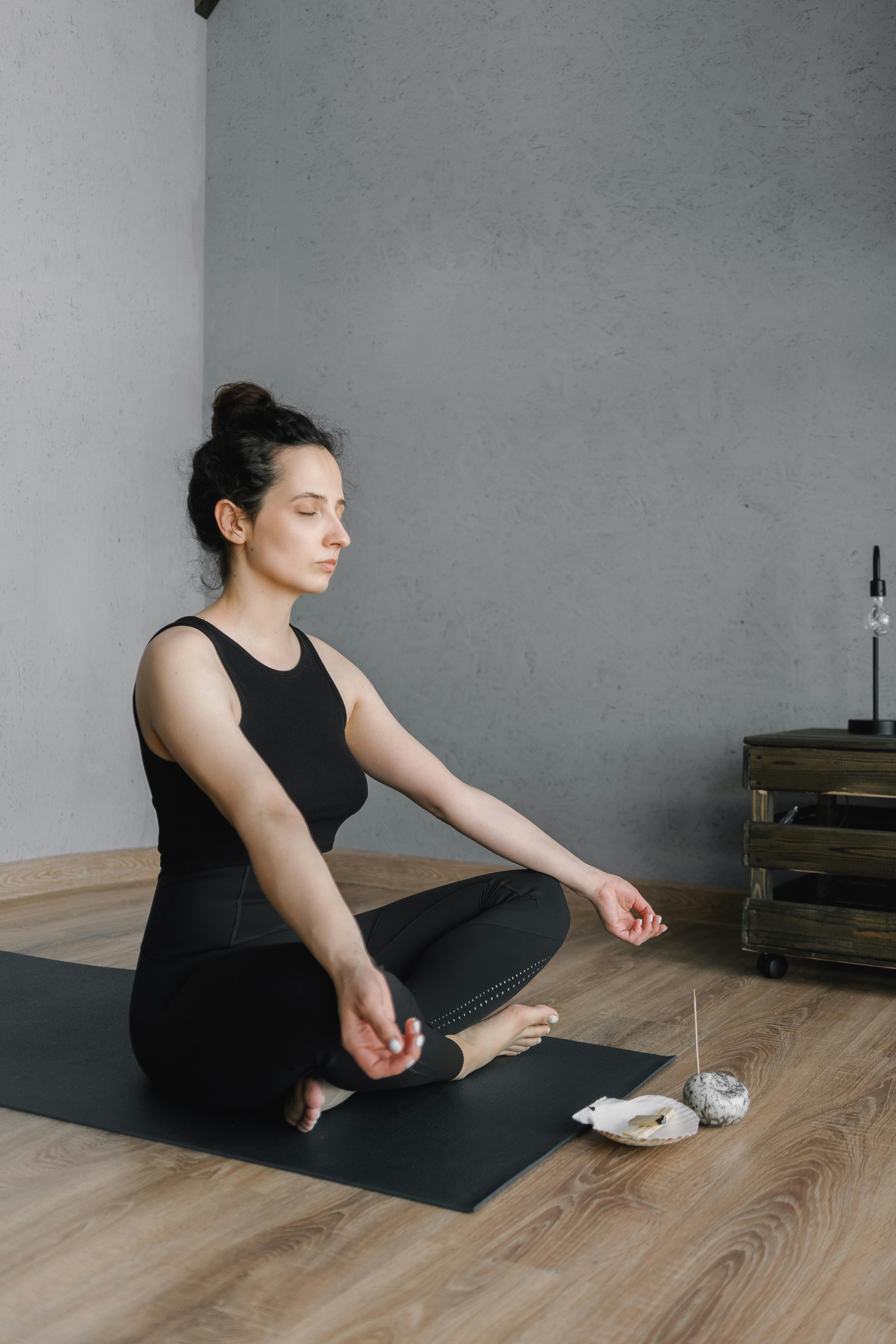 Woman practicing yoga for stress relief during perimenopause