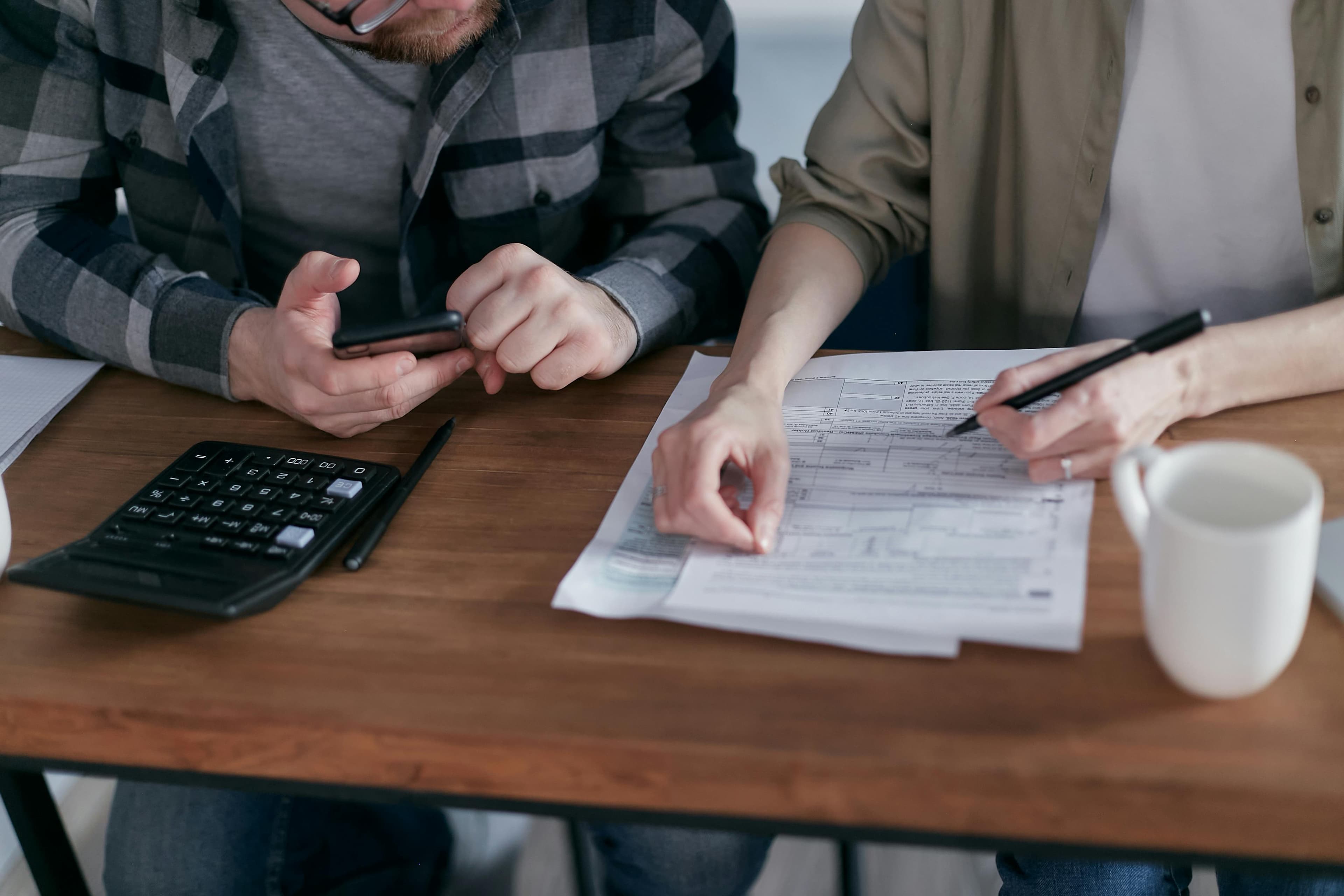 A person reviewing insurance documents and medical bills