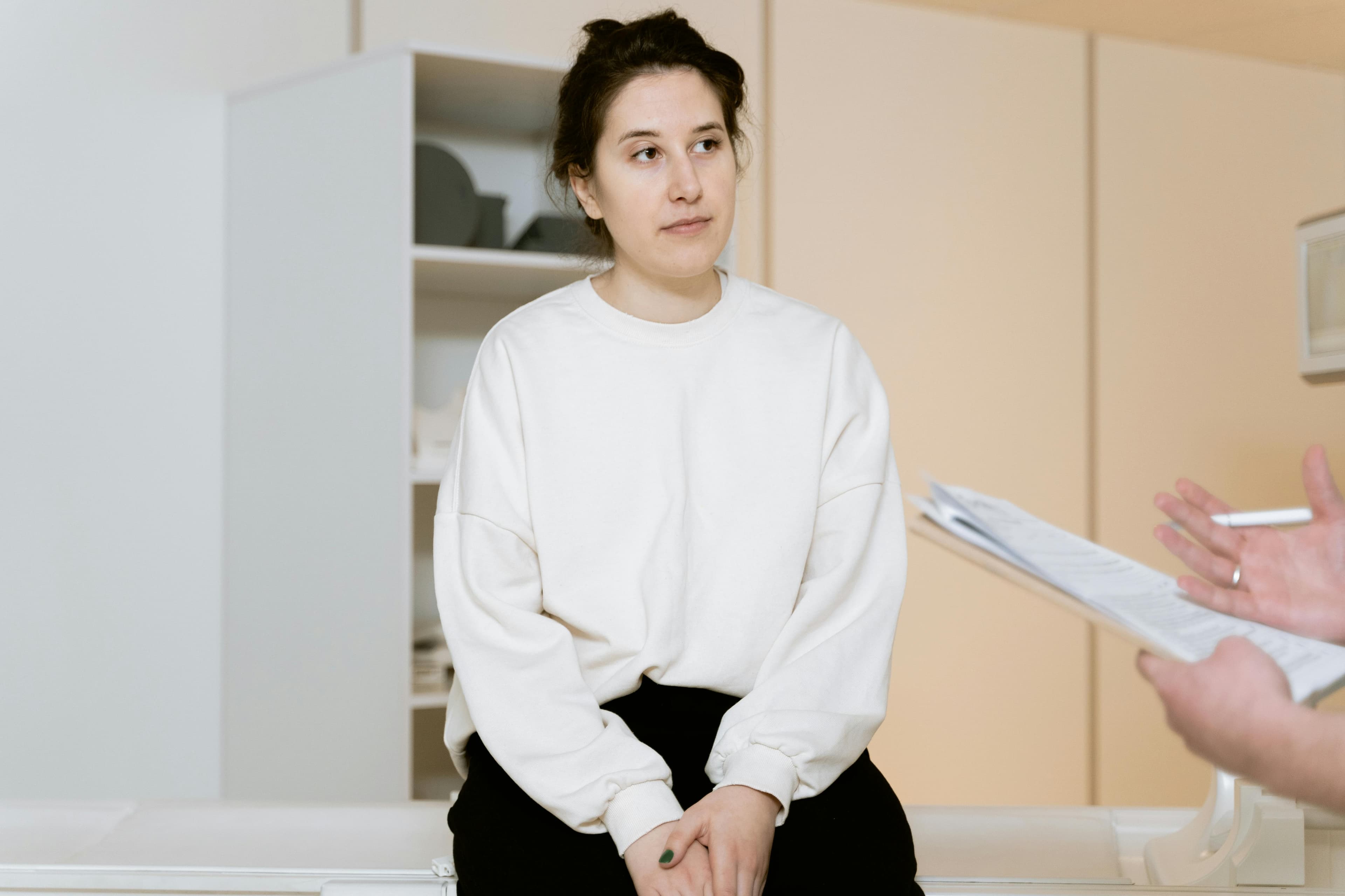 A mature woman consulting with her doctor about menopause symptoms
