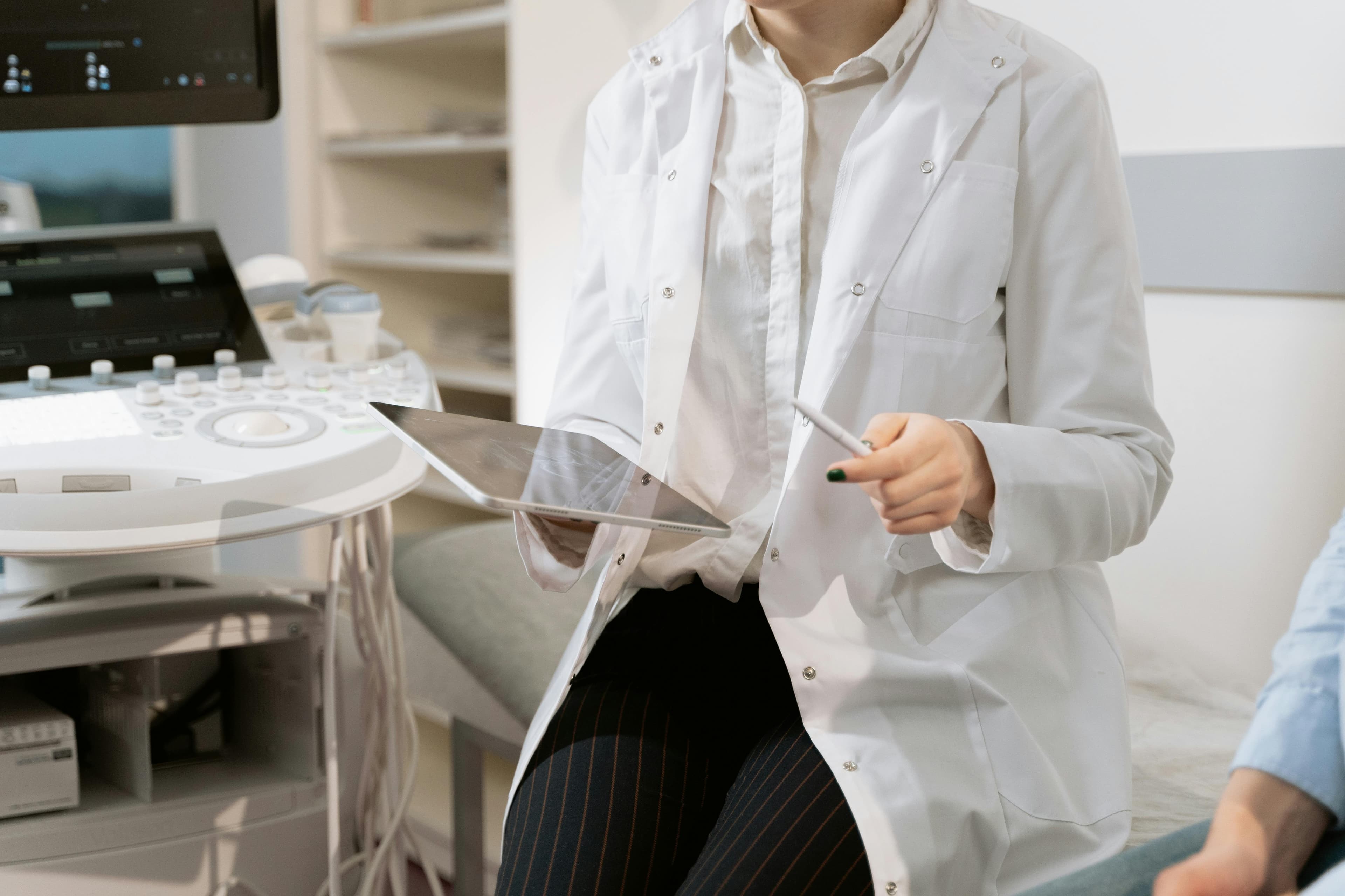 Medical professional examining ultrasound images of the uterus