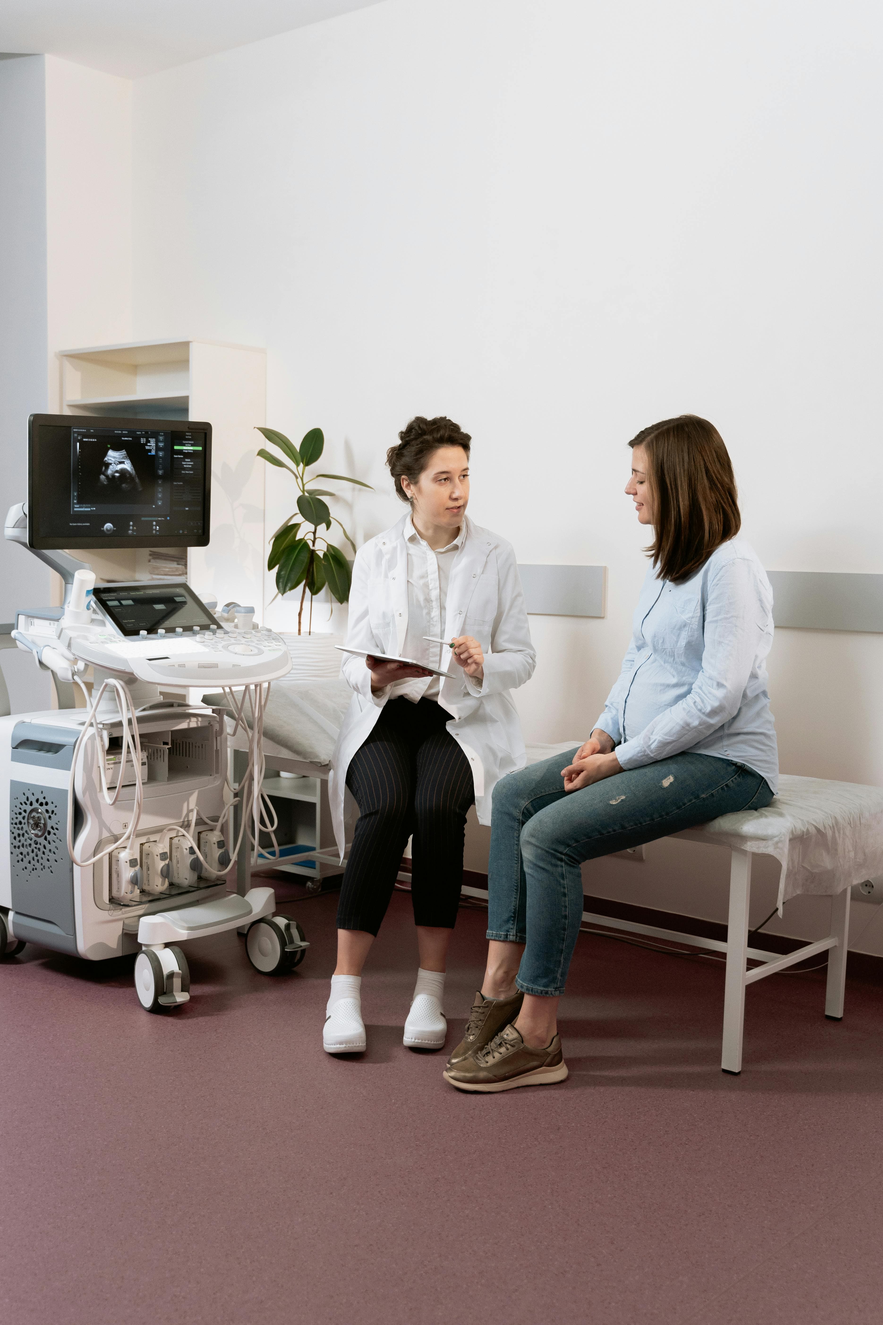 A doctor discussing medication options with a patient in an examination room