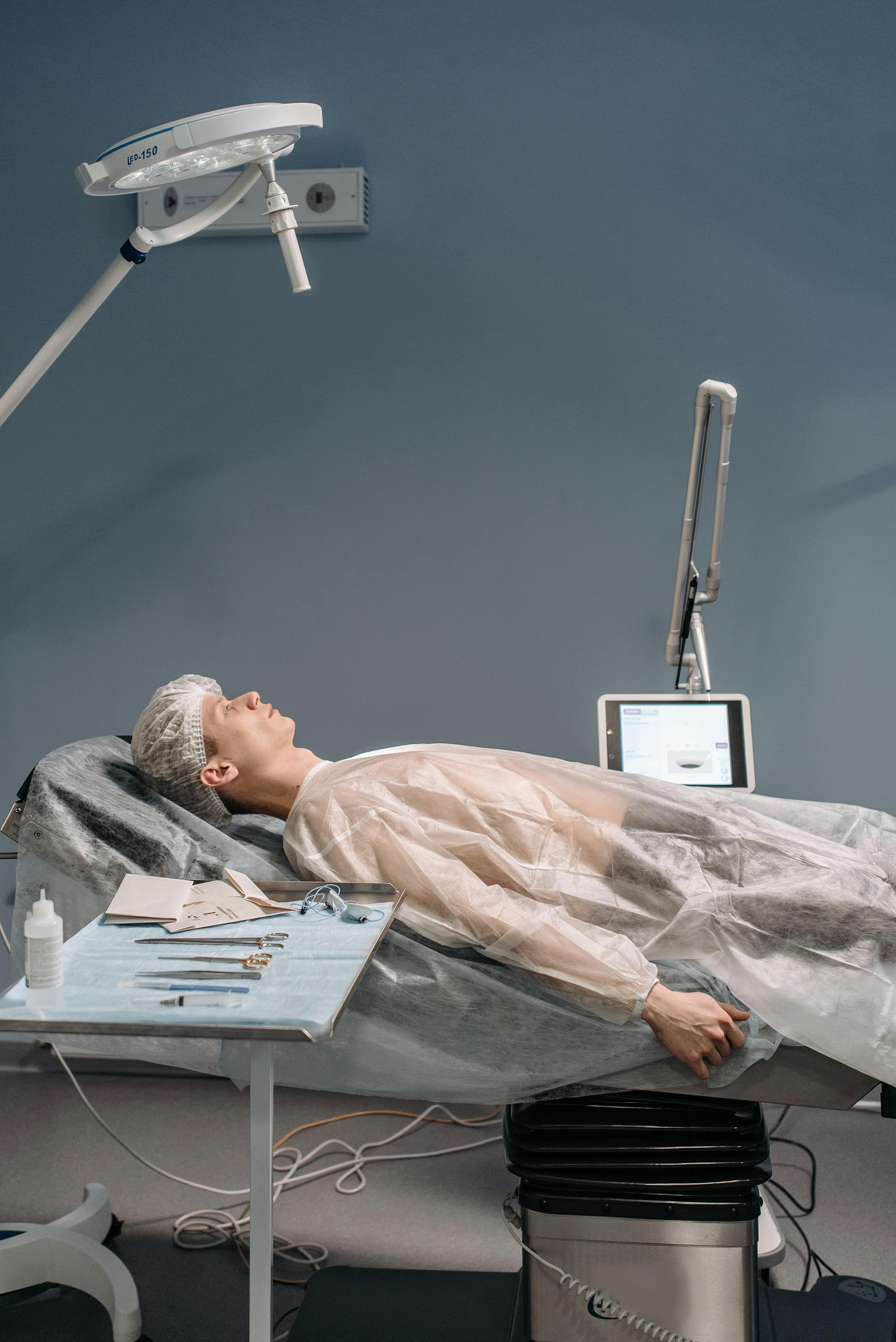 Patient recovering in hospital bed after anesthesia