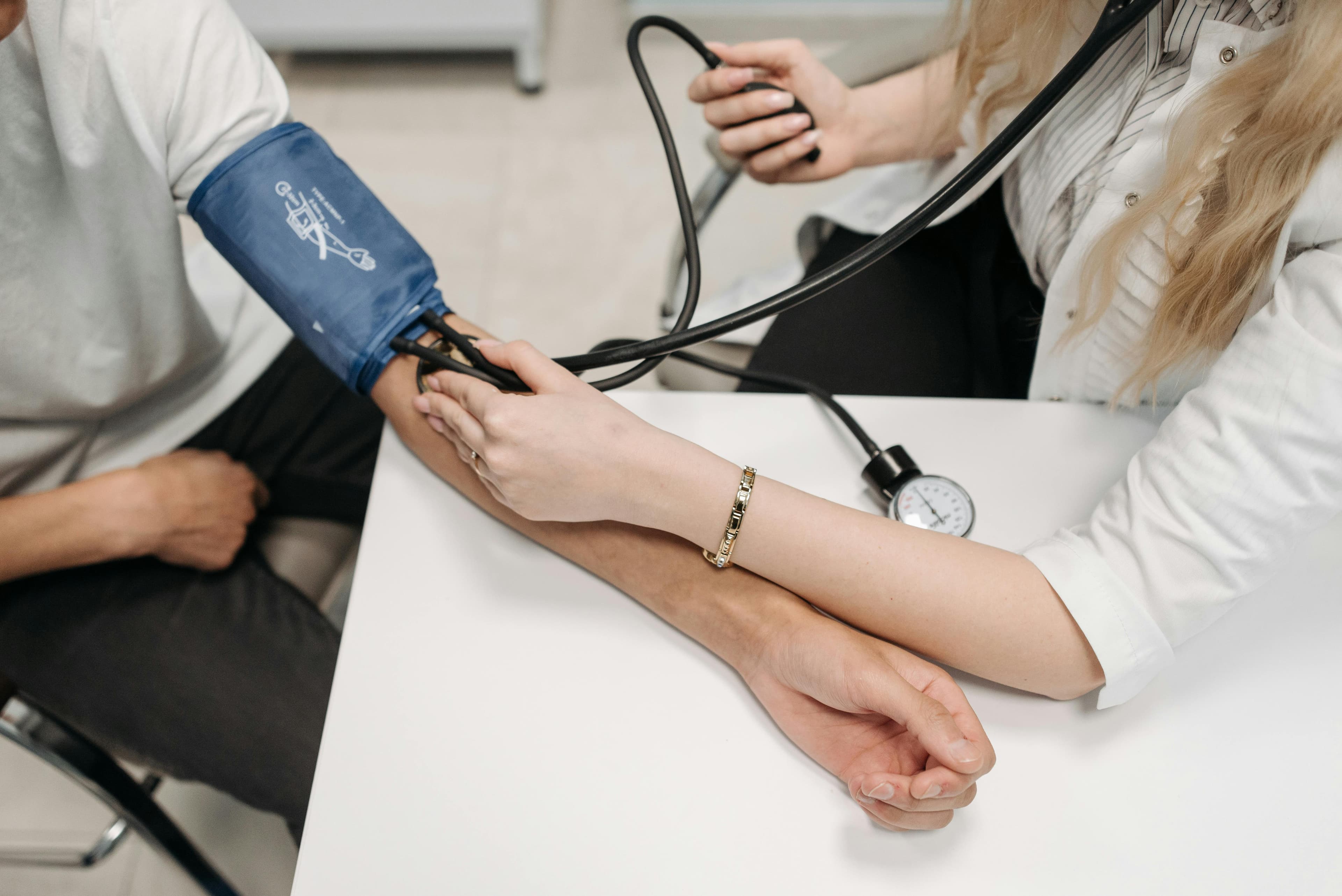 A cardiologist reviewing an electrocardiogram of a patient on hydroxychloroquine therapy