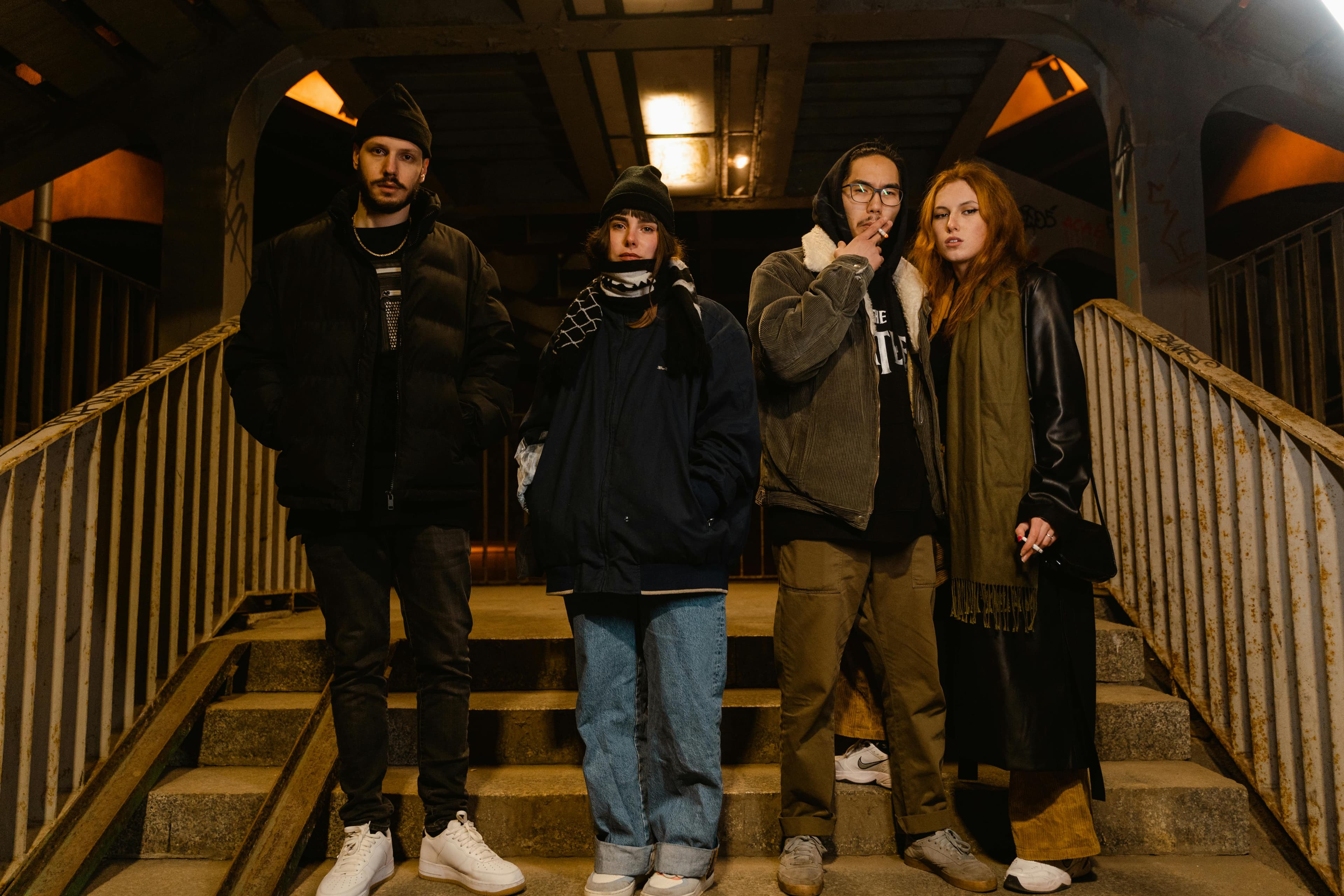 A group of young adults smoking hookah in a social setting